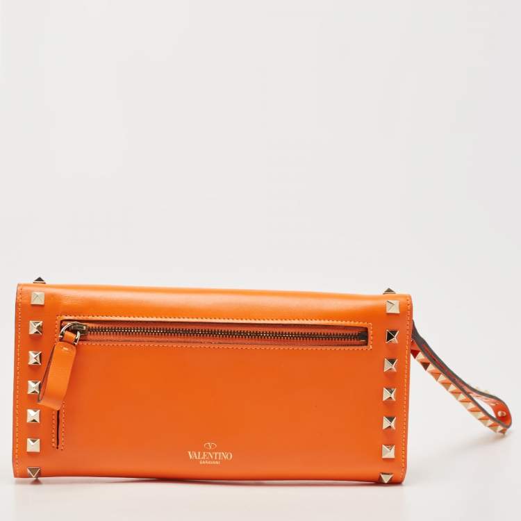 Pre Owned Valentino Neon Orange Leather Rockstud Trifold Wristlet Clutch