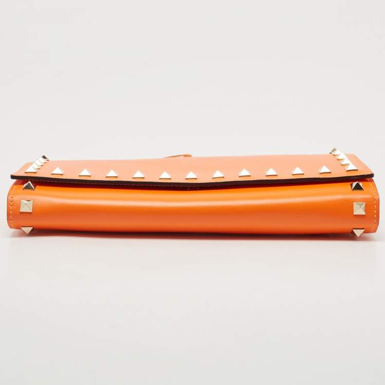 Pre Owned Valentino Neon Orange Leather Rockstud Trifold Wristlet Clutch