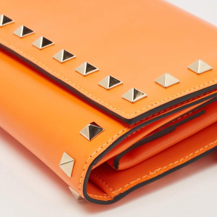 Pre Owned Valentino Neon Orange Leather Rockstud Trifold Wristlet Clutch