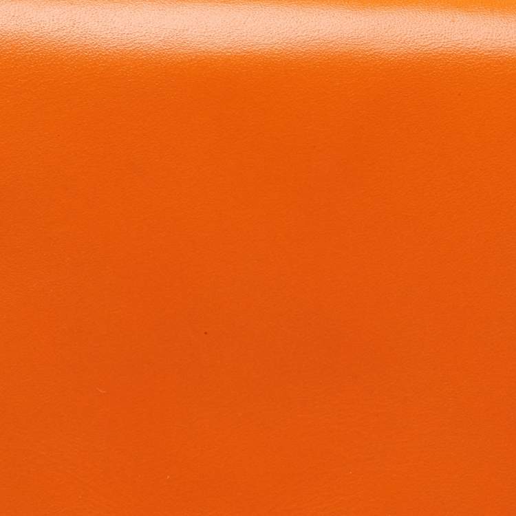 Pre Owned Valentino Neon Orange Leather Rockstud Trifold Wristlet Clutch
