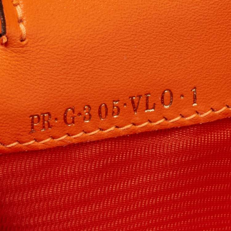 Pre Owned Valentino Neon Orange Leather Rockstud Trifold Wristlet Clutch