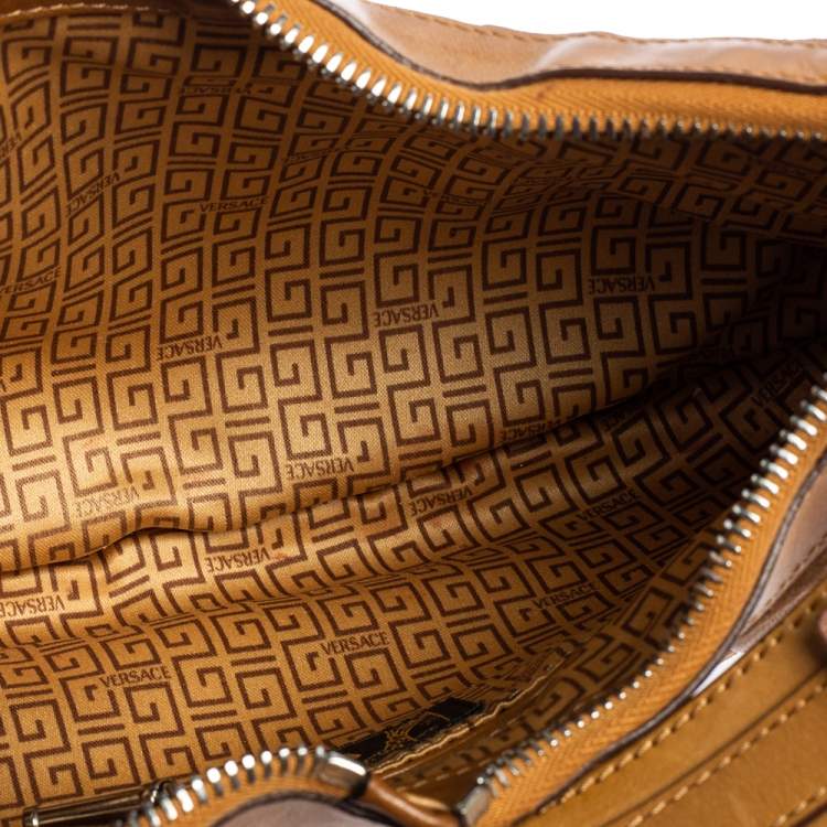 Pre Owned Versace Tan Logo Embossed Suede and Leather Charm Baguette Bag
