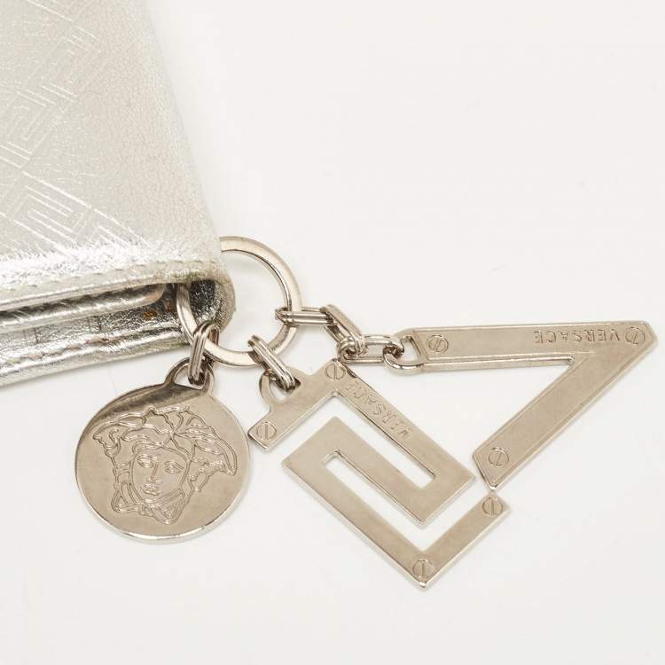 Pre Owned Versace Silver Embossed Leather V Charm Trifold Wallet