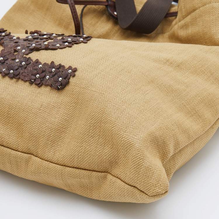 Pre Owned Yves Saint Laurent Beige/Brown Straw and Leather Drawstring Tote