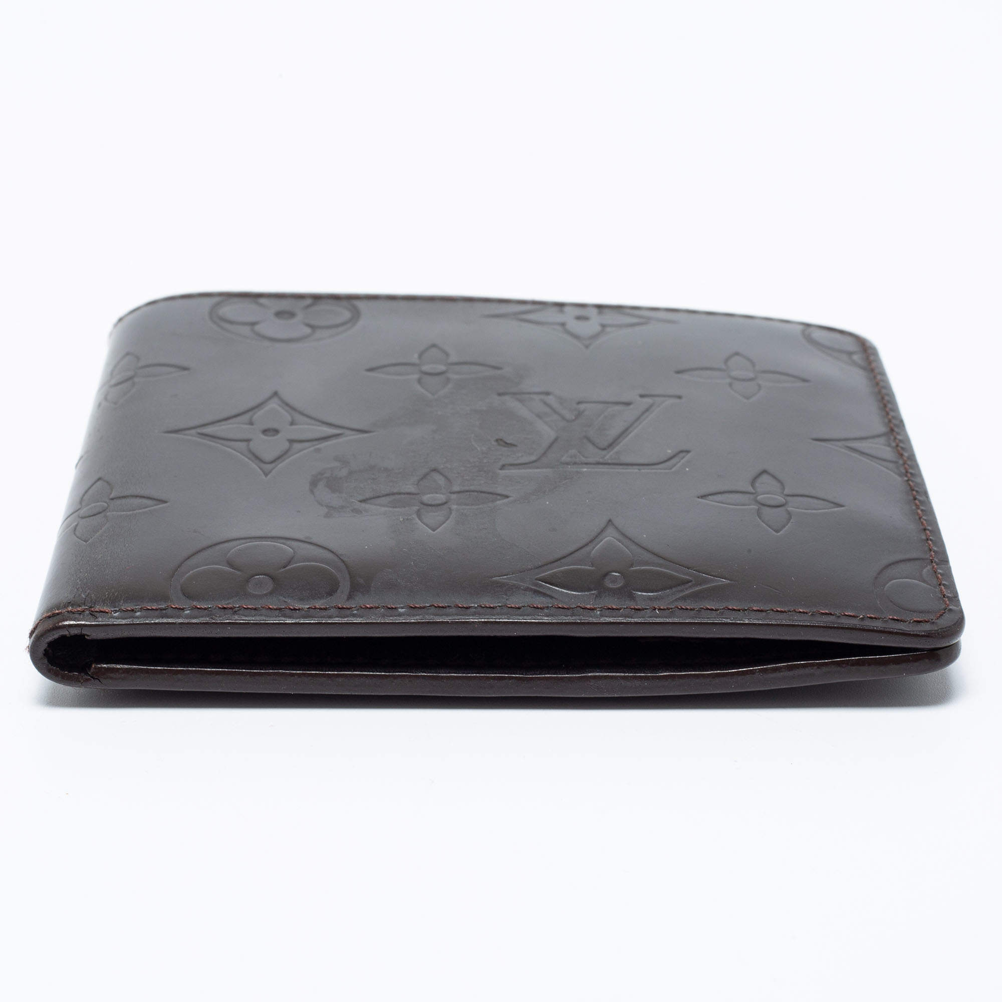 Louis Vuitton, a black, embossed leather wallet, 2015. - Bukowskis