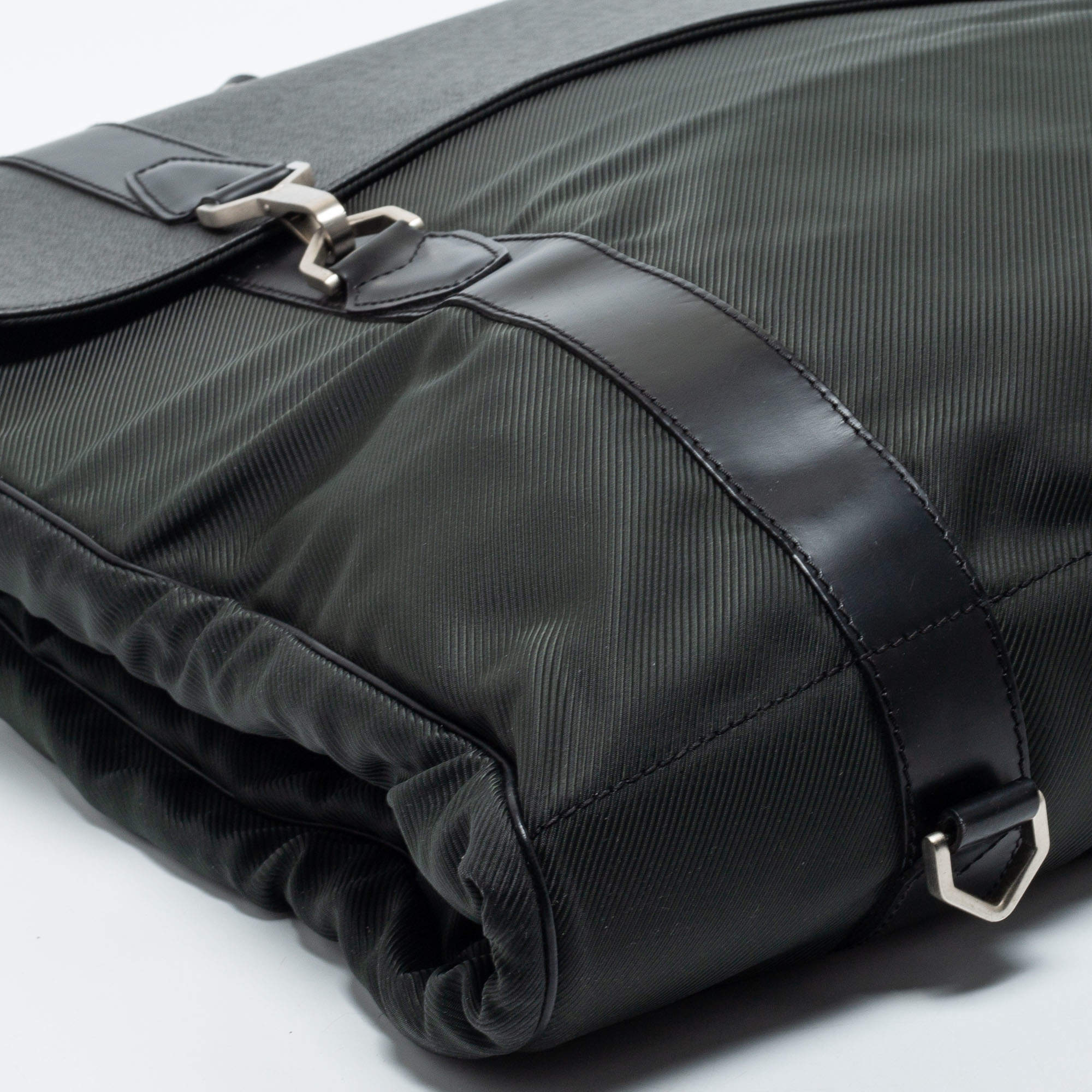 Louis Vuitton, A Gibeciere taiga and nylon garment bag. - Bukowskis