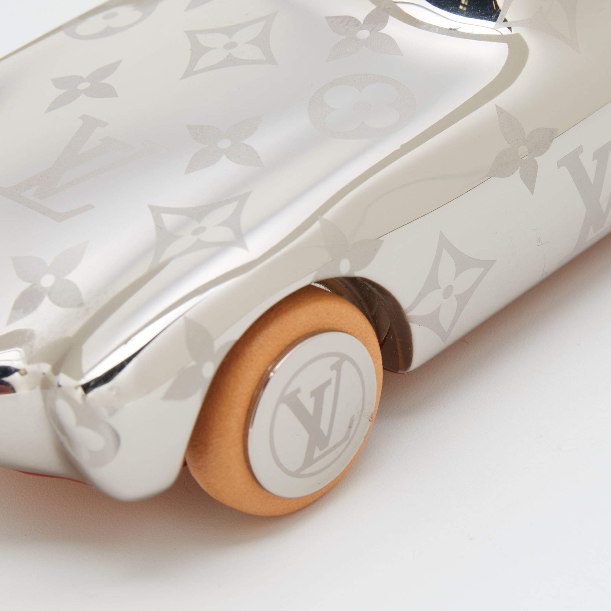 Sold at Auction: Louis Vuitton Gold Voguez Volez Voyagez Car Paperweight  Condition: 1 6.5 Width