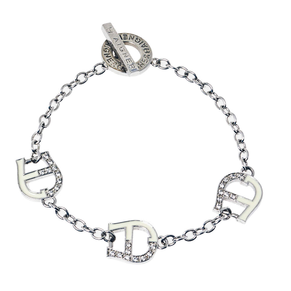 Aigner Silver Tone Crystal and Enamel Logo Toggle Bracelet 