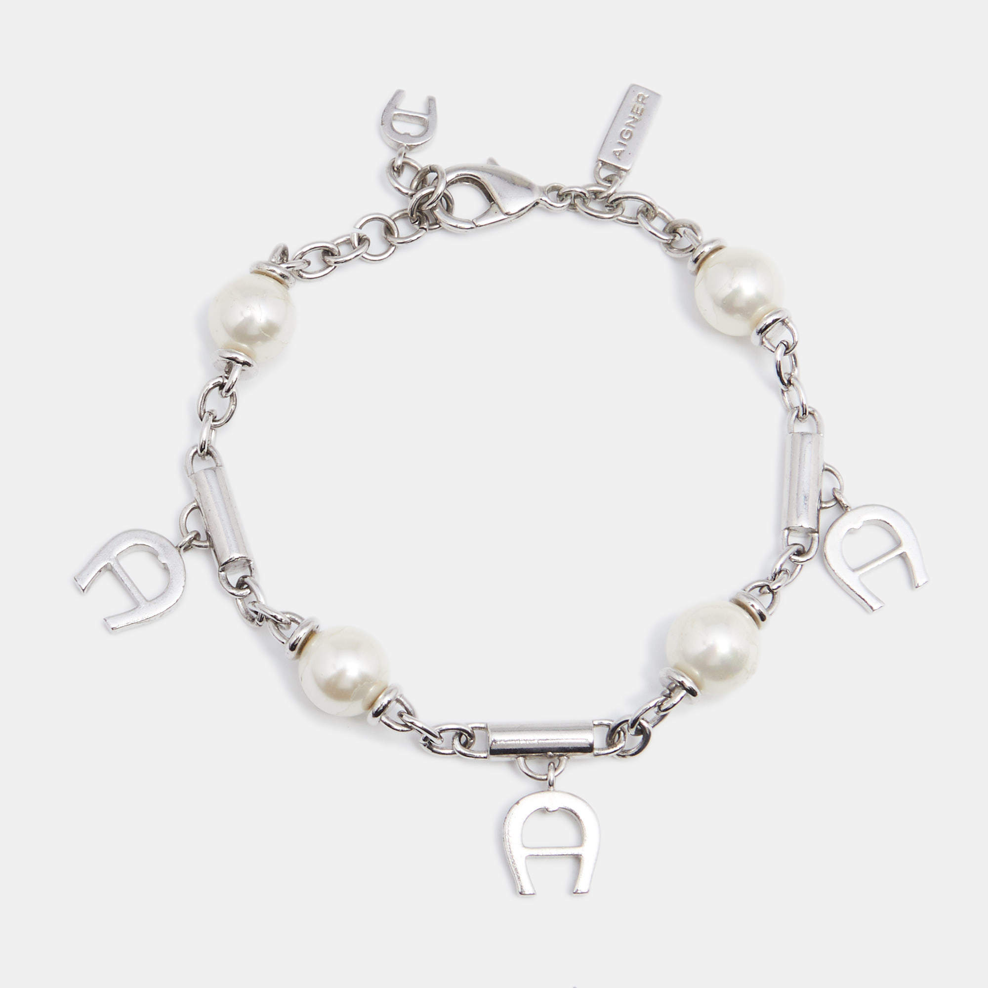 Pre Owned Aigner Silver Tone Logo Charms Pearl Station Bracelet