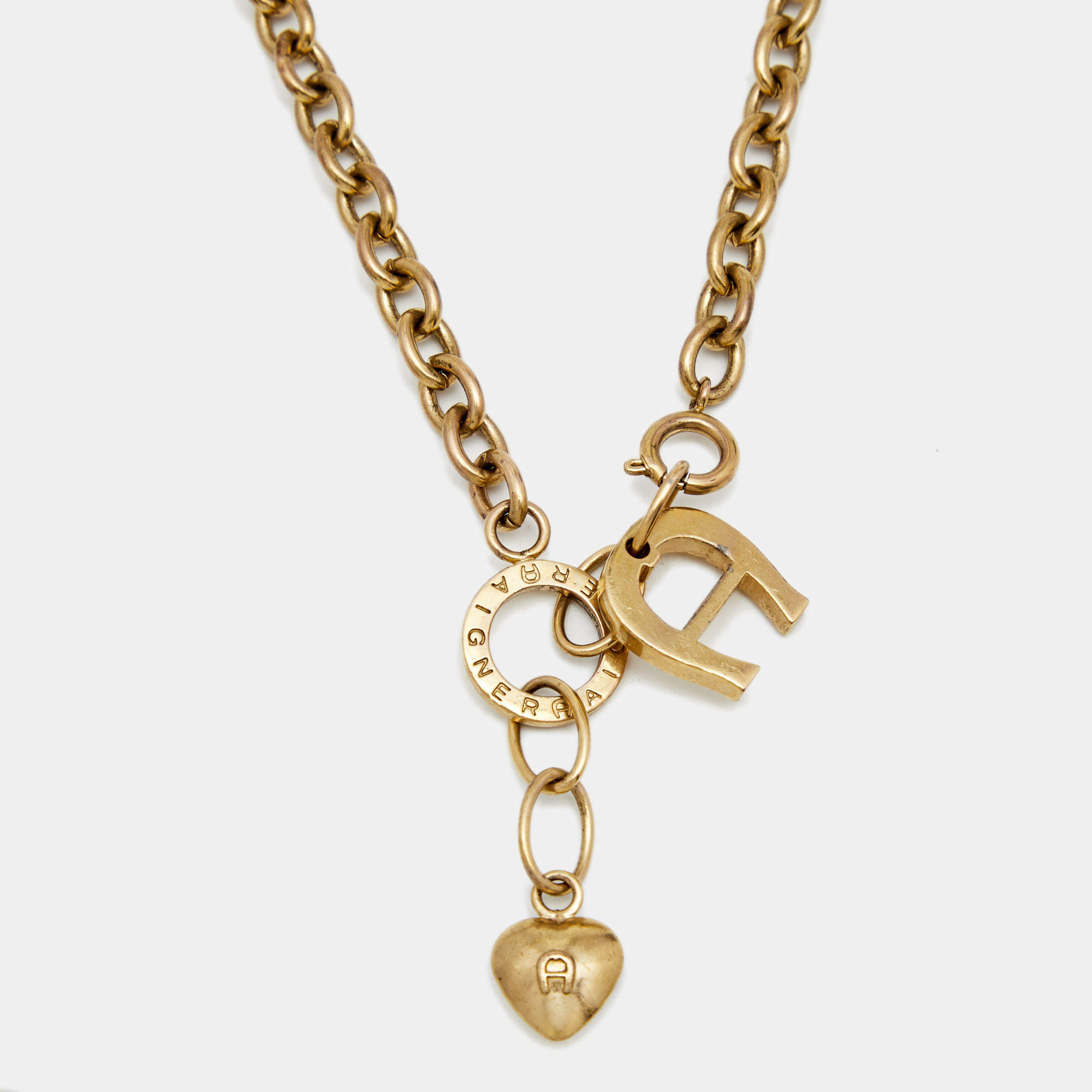 Pre Owned Aigner Gold Tone Logo & Heart Pendant Necklace