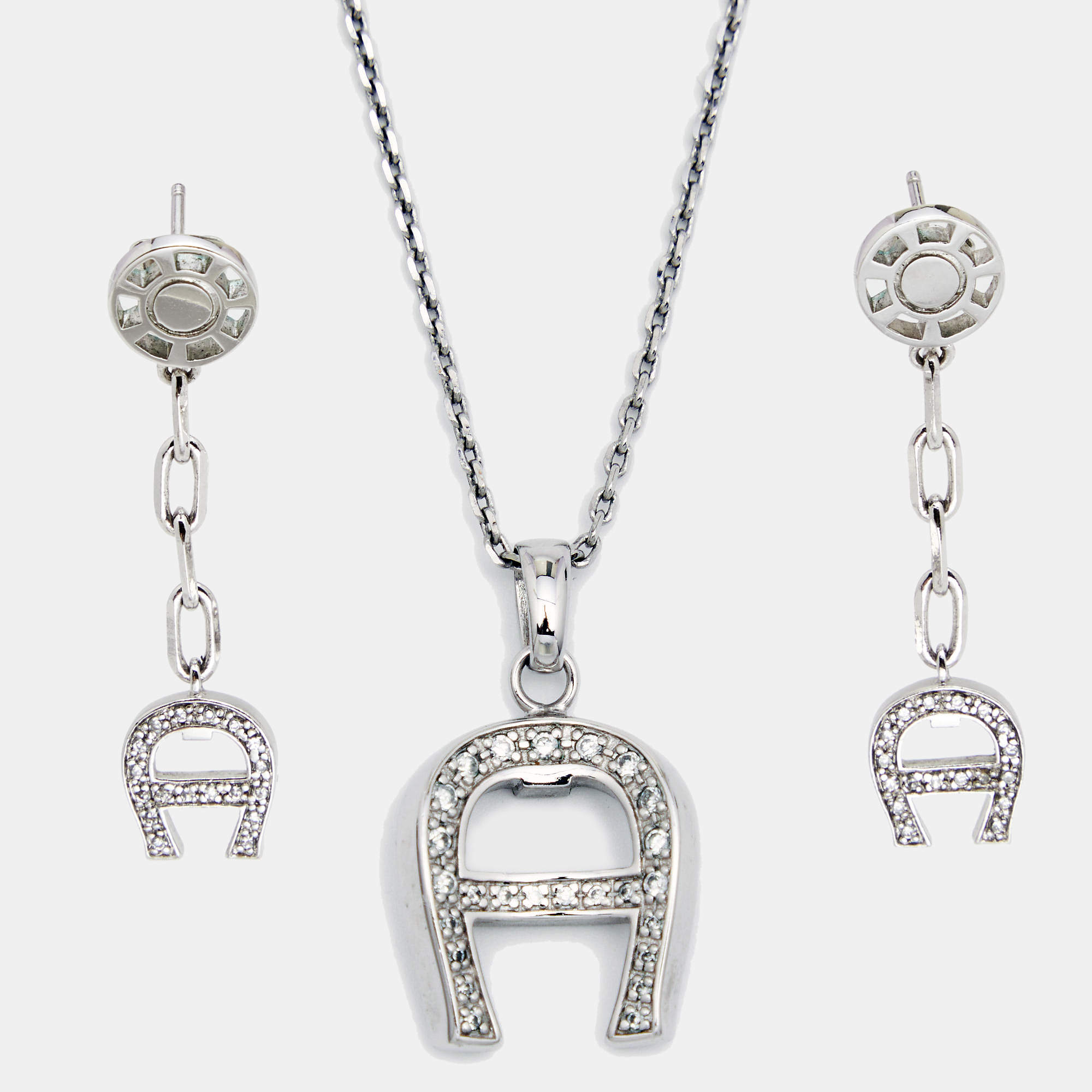 Pre Owned Aigner Silver Tone Crystal Logo Pendant Necklace & Earrings Set