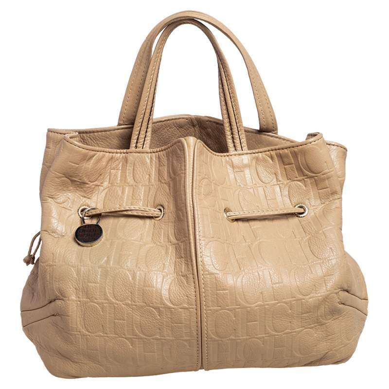 Pre Owned Carolina Herrera Beige Monogram Embossed Leather Drawstring Tote