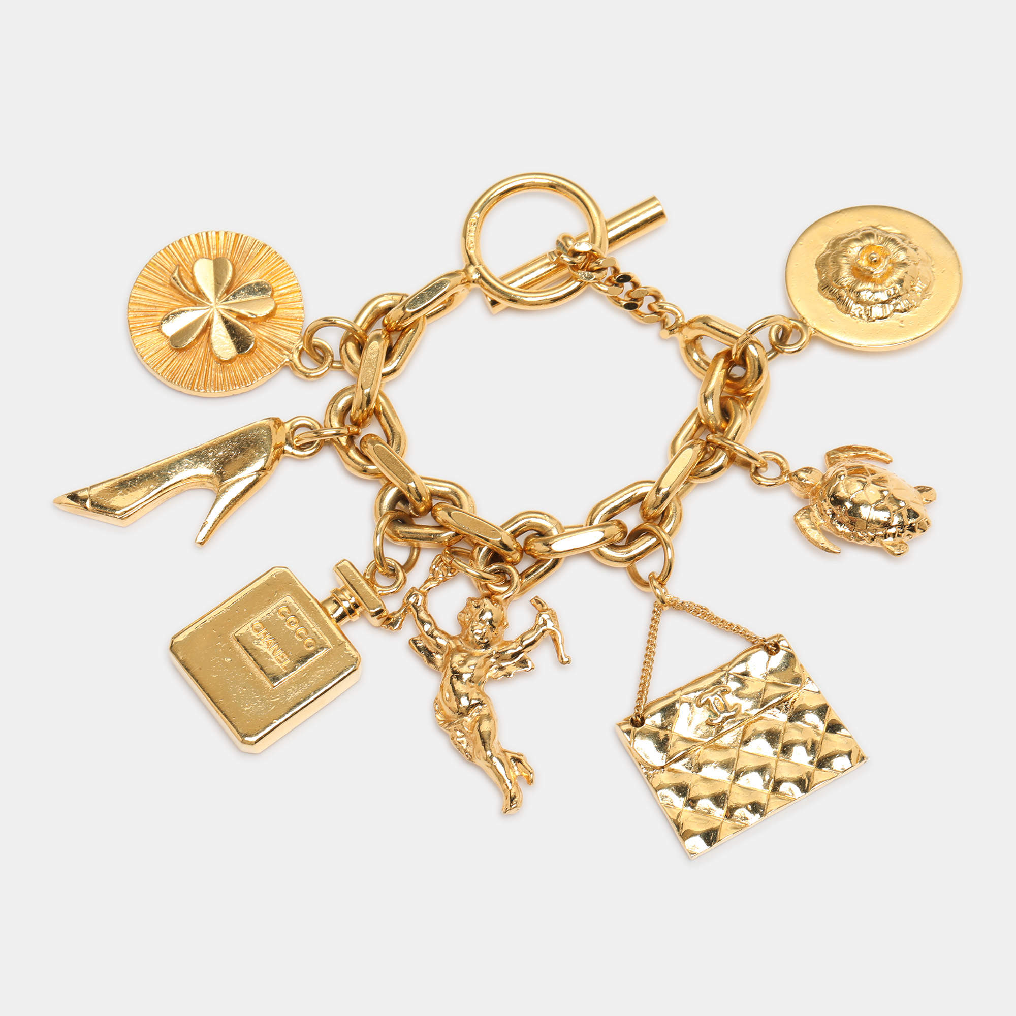 Pre Owned Chanel Gold Tone Hardware 7 Iconic Charm Bracelet
