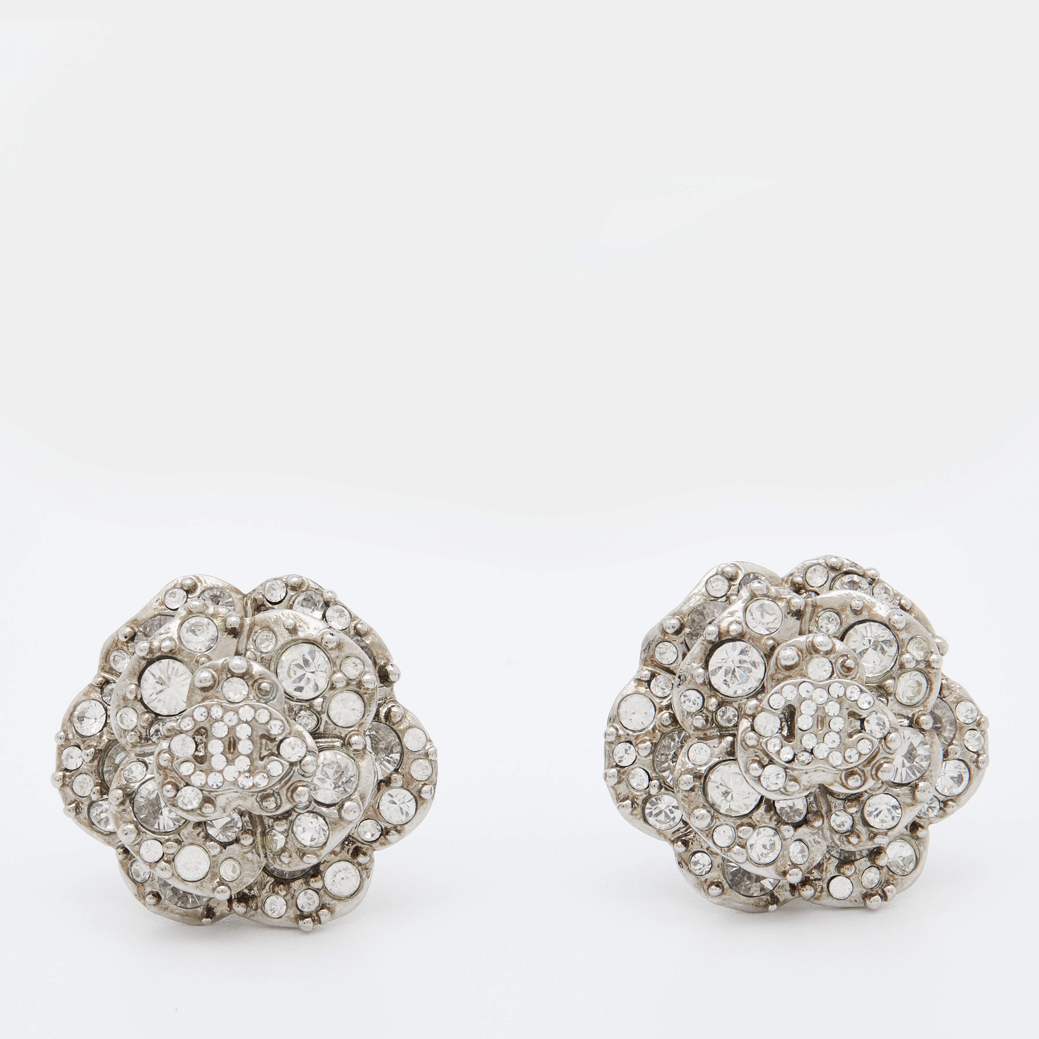 Pre Owned Chanel Silver Tone CC Crystal Camellia Clip-On Earrings