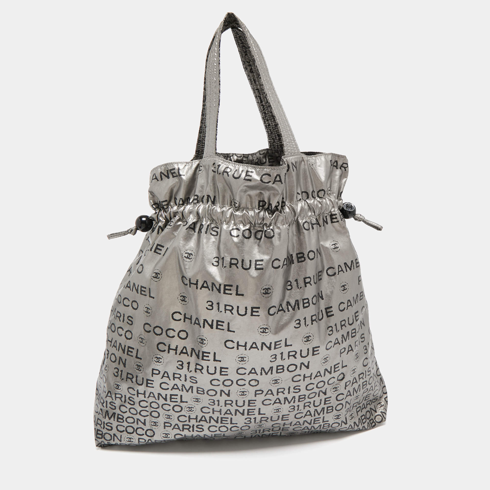 Pre Owned Chanel Silver Coated Nylon 31 Rue Cambon Graphic Drawstring Tote