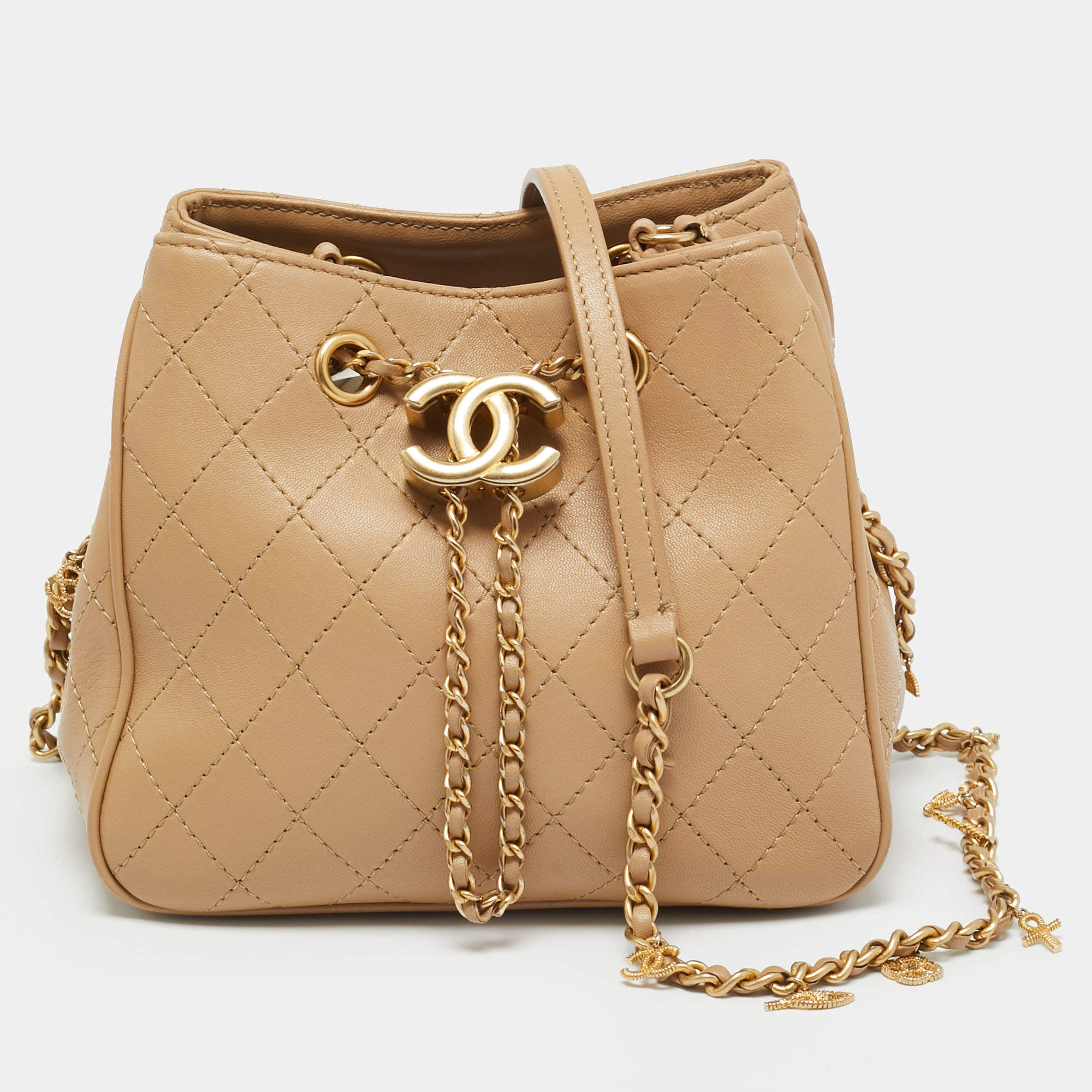 Pre Owned Chanel Egyptian Amulet Beige Quilted Leather Drawstring Bucket Bag