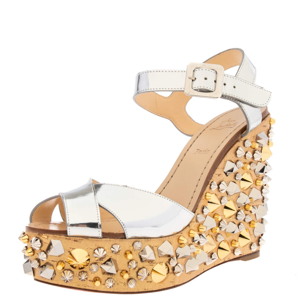 مملوكة مسبقًا Christian Louboutin Metallic Silver Leather And Fabric Studded Almeria Cork Wedge Sandals Size 38