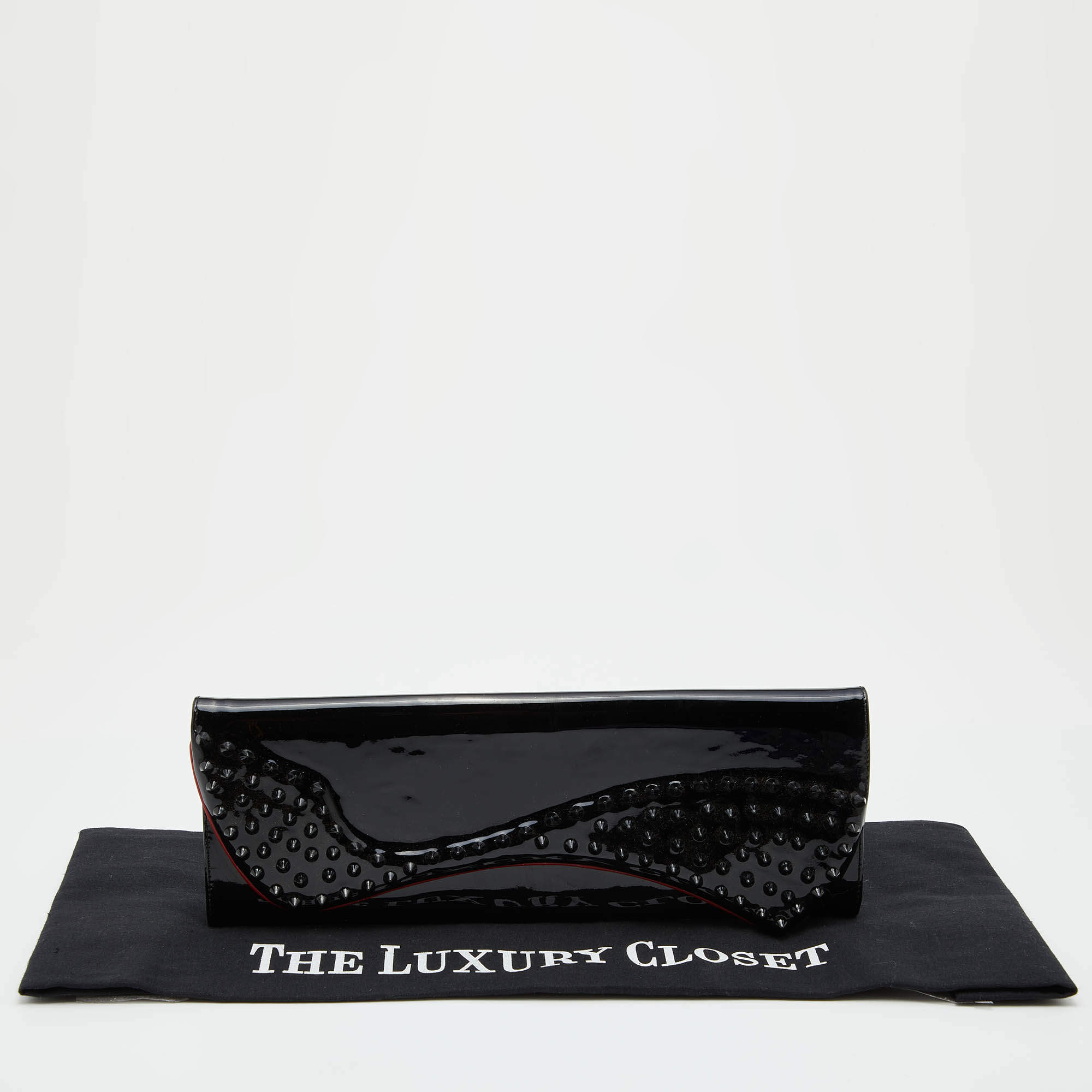 Patent leather clutch bag Christian Louboutin Black in Patent leather -  35914275