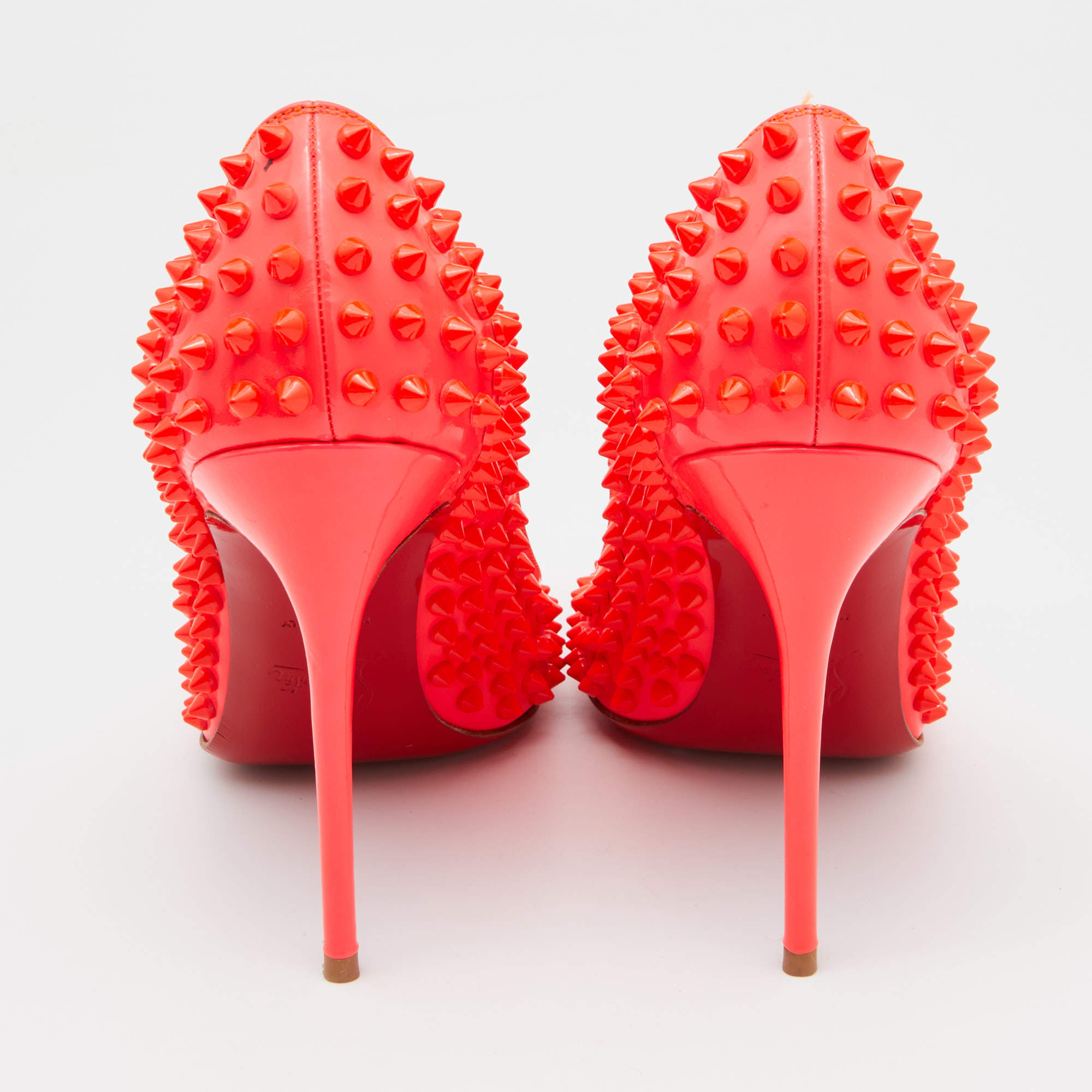 Neon coral Christian Louboutin spiked heels  Christian louboutin, Christian  louboutin pigalle, Louboutin