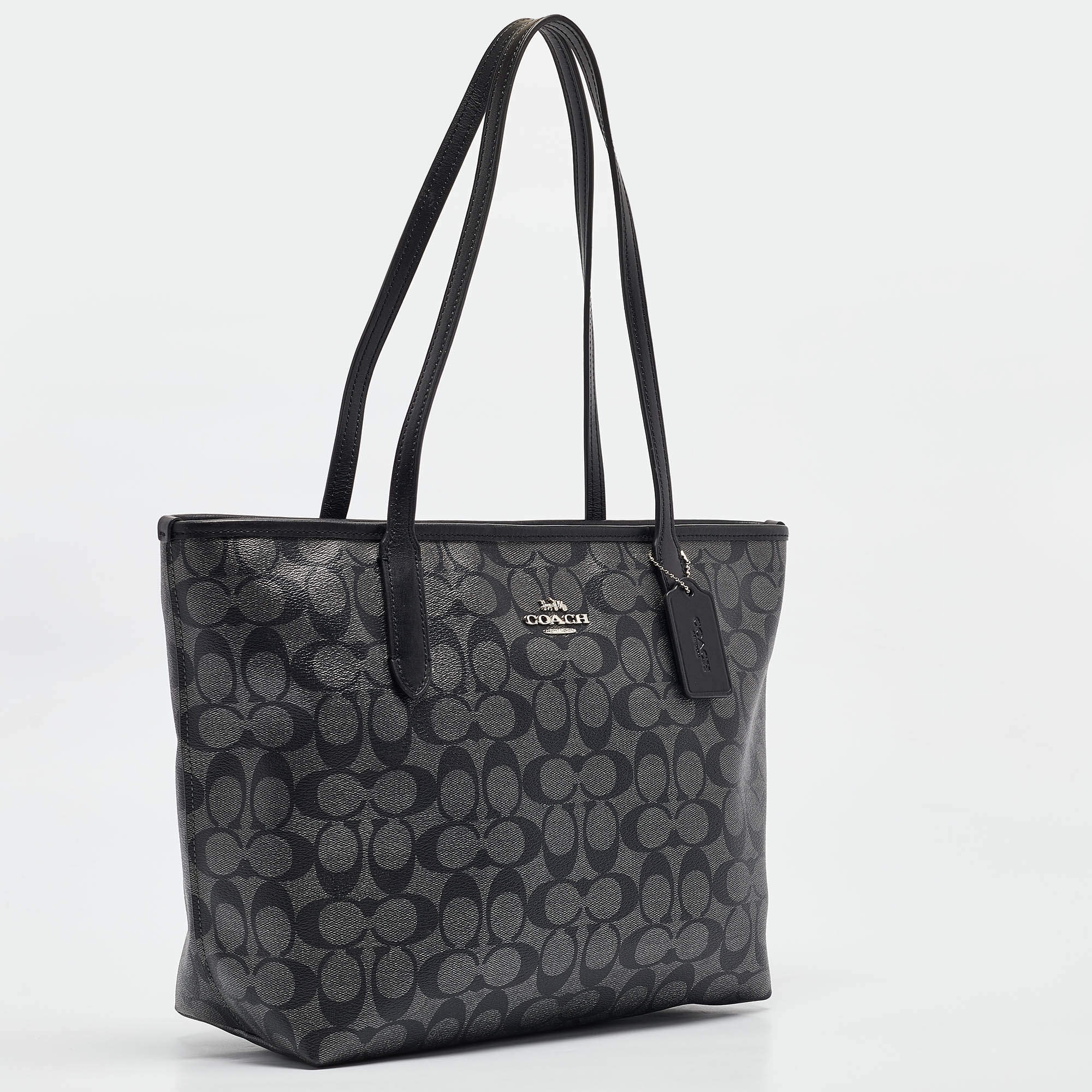 Pre Owned Coach Black/Silver Signature Coated Canvas and Leather City Zip Tote
