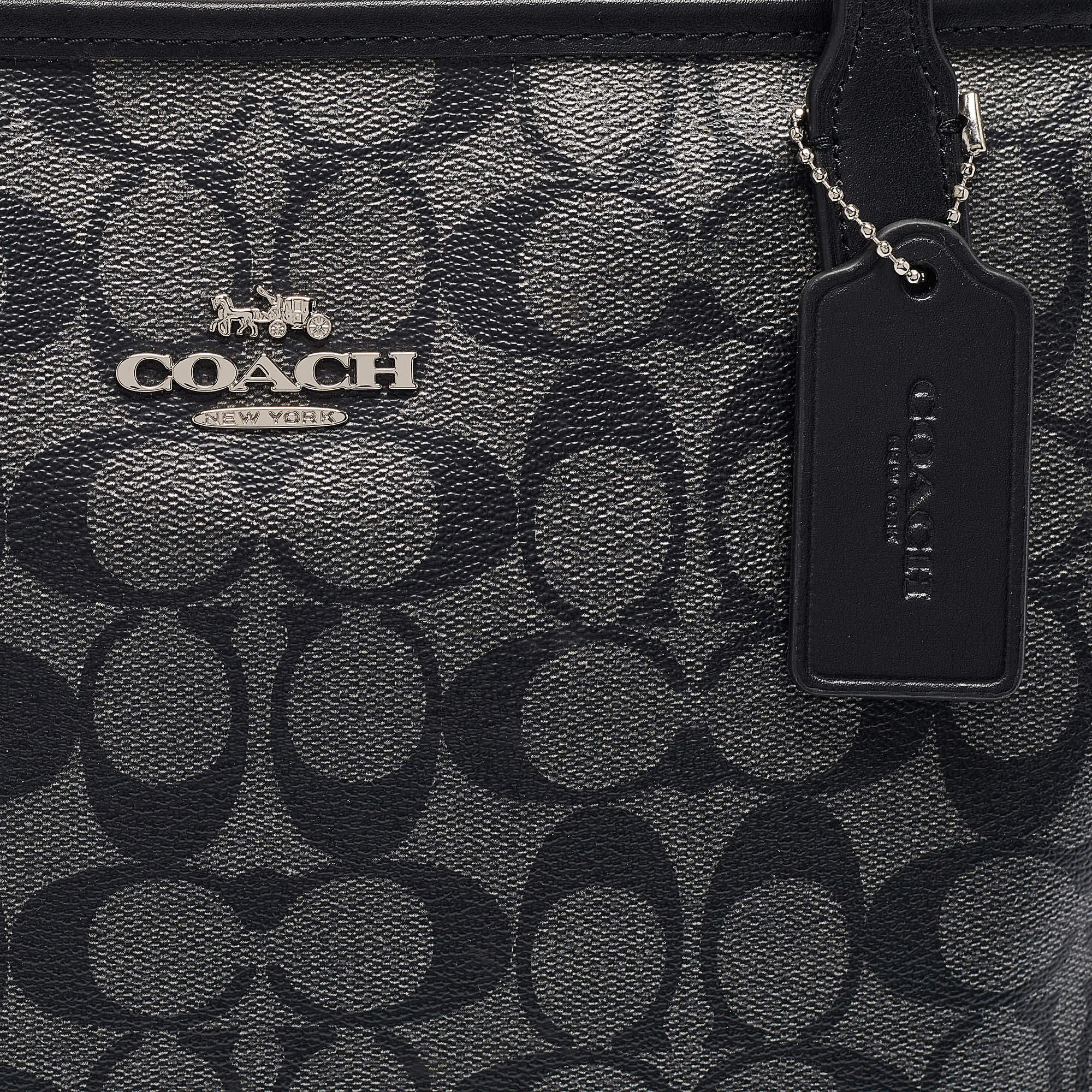 Pre Owned Coach Black/Silver Signature Coated Canvas and Leather City Zip Tote