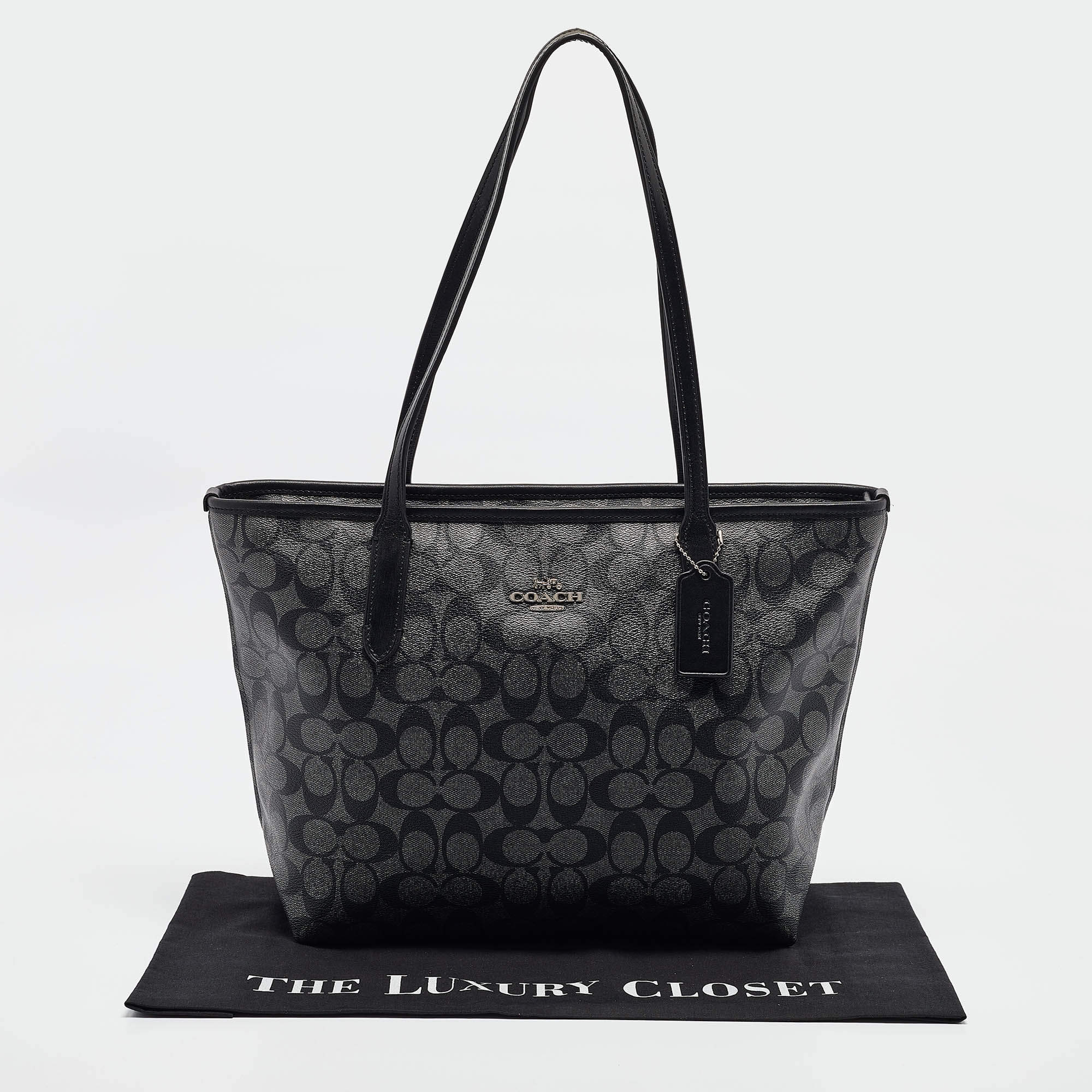 Pre Owned Coach Black/Silver Signature Coated Canvas and Leather City Zip Tote