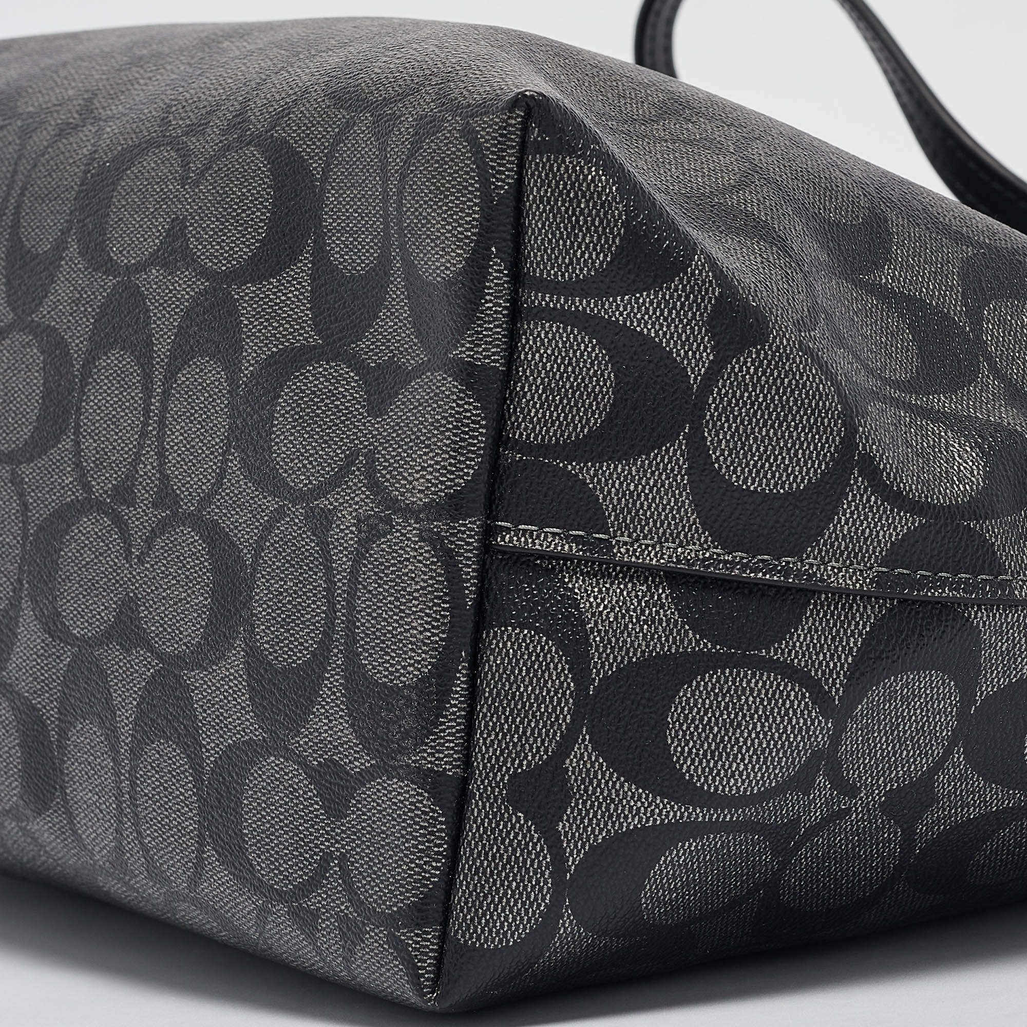 Pre Owned Coach Black/Silver Signature Coated Canvas and Leather City Zip Tote