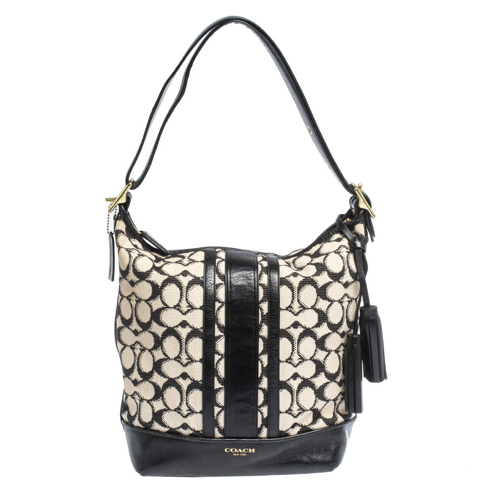 Pre Owned Coach Black/White Signature Canvas and Leather Tassel Hobo