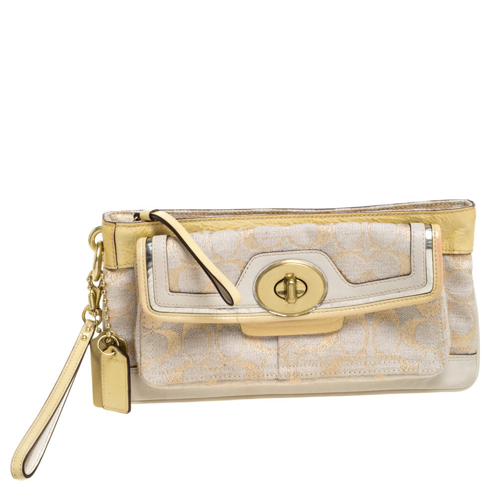 Pre Owned Coach Beige/Cream Signature Canvas and Leather Turnlock Pocket Wristlet Clutch