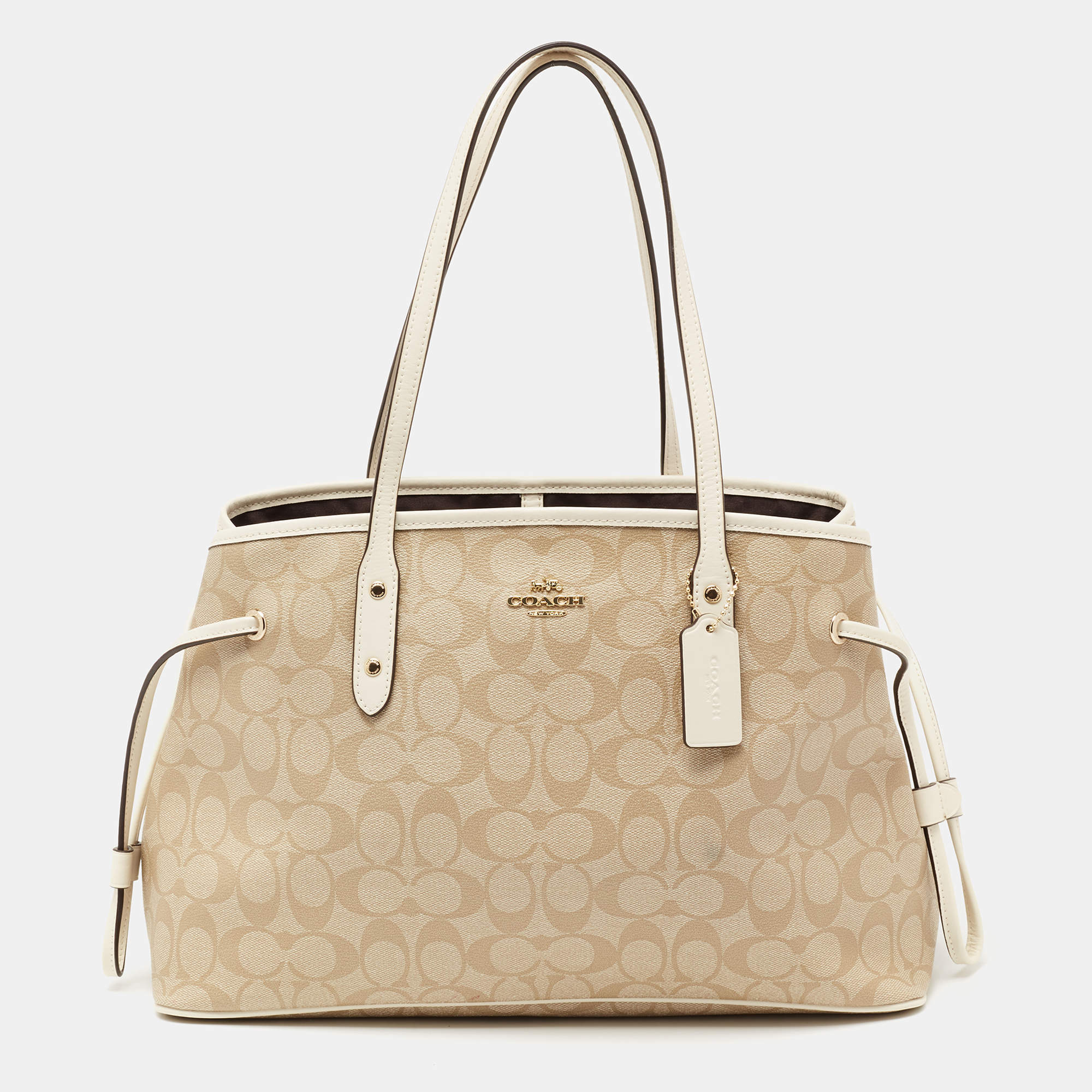 Pre Owned Coach Cream/Beige Signature Coated Canvas and Leather Drawstring Carryall Satchel