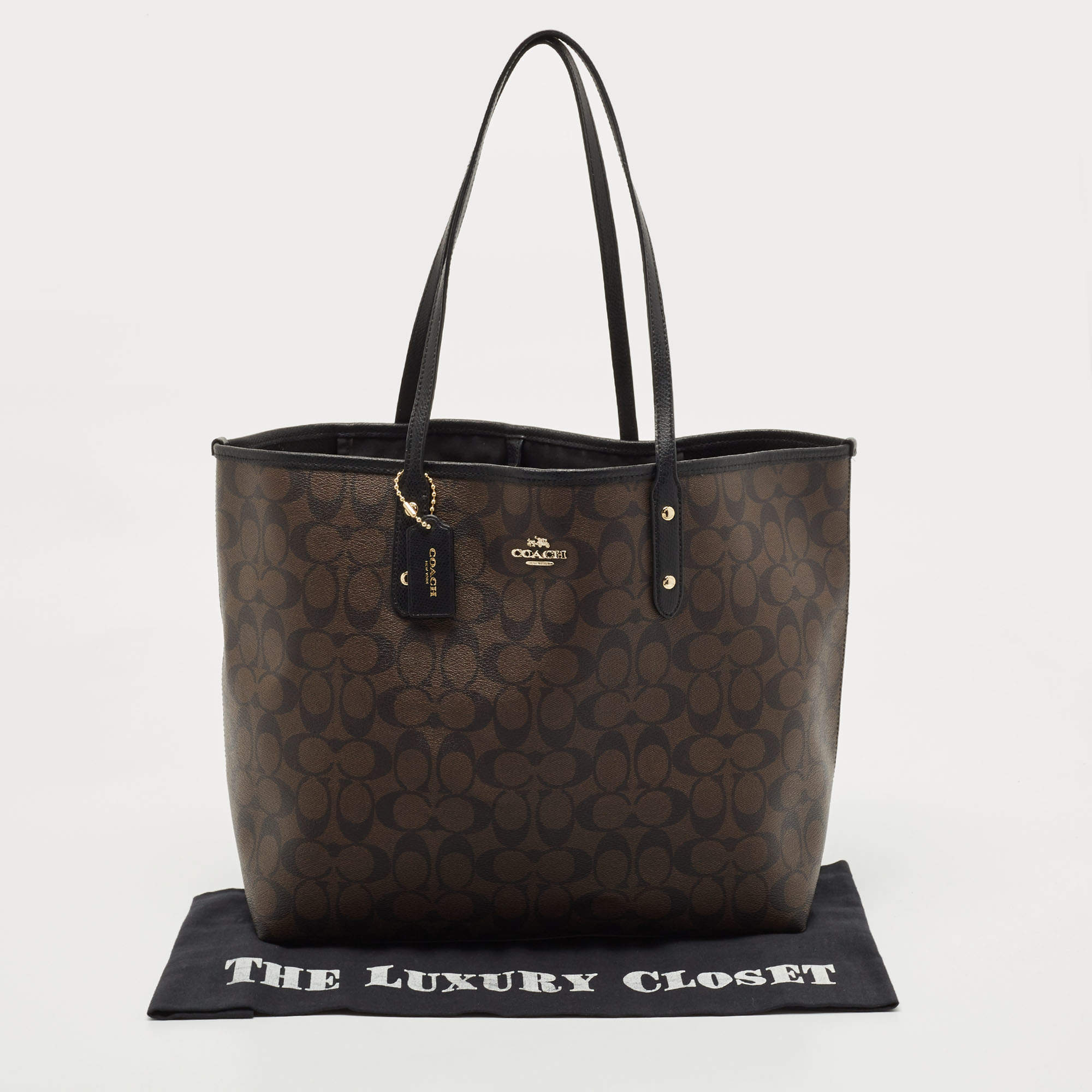 Discover the Elegance of Coach Dark Brown Purse