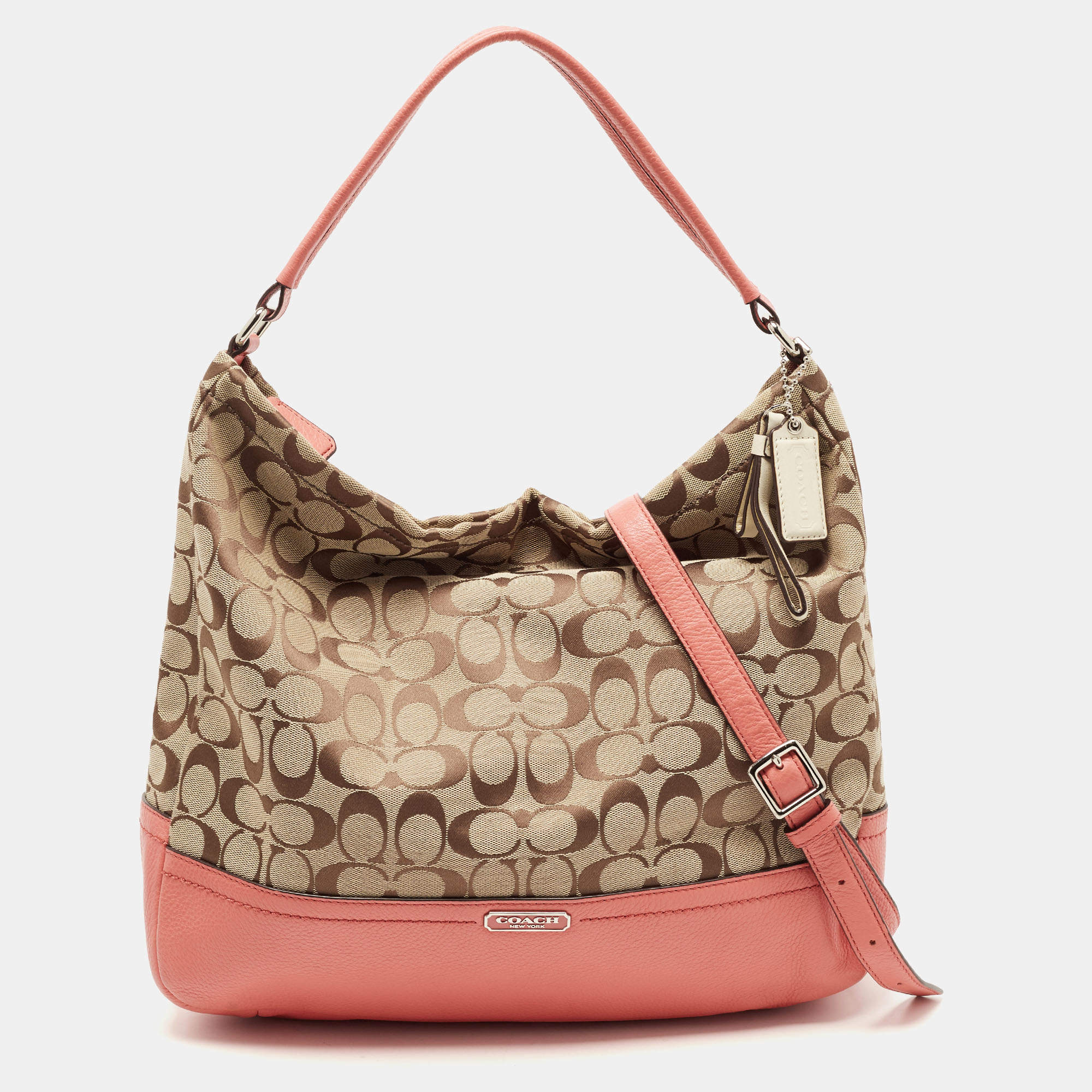 Pre Owned Coach Beige/Coral Orange Signature Canvas and Leather Park Hobo