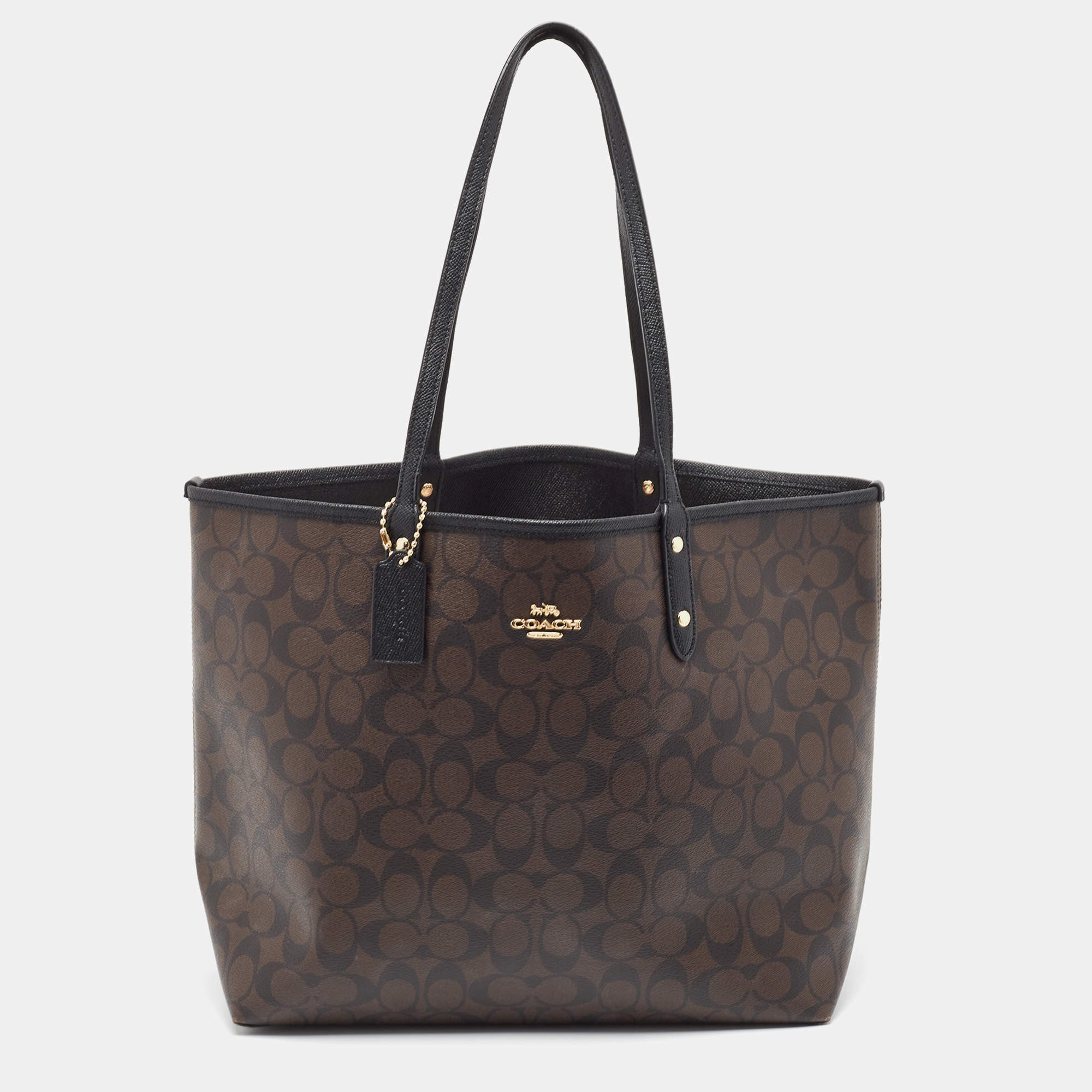 Pre Owned Coach Brown/Black Signature Coated Canvas Reversible City Tote