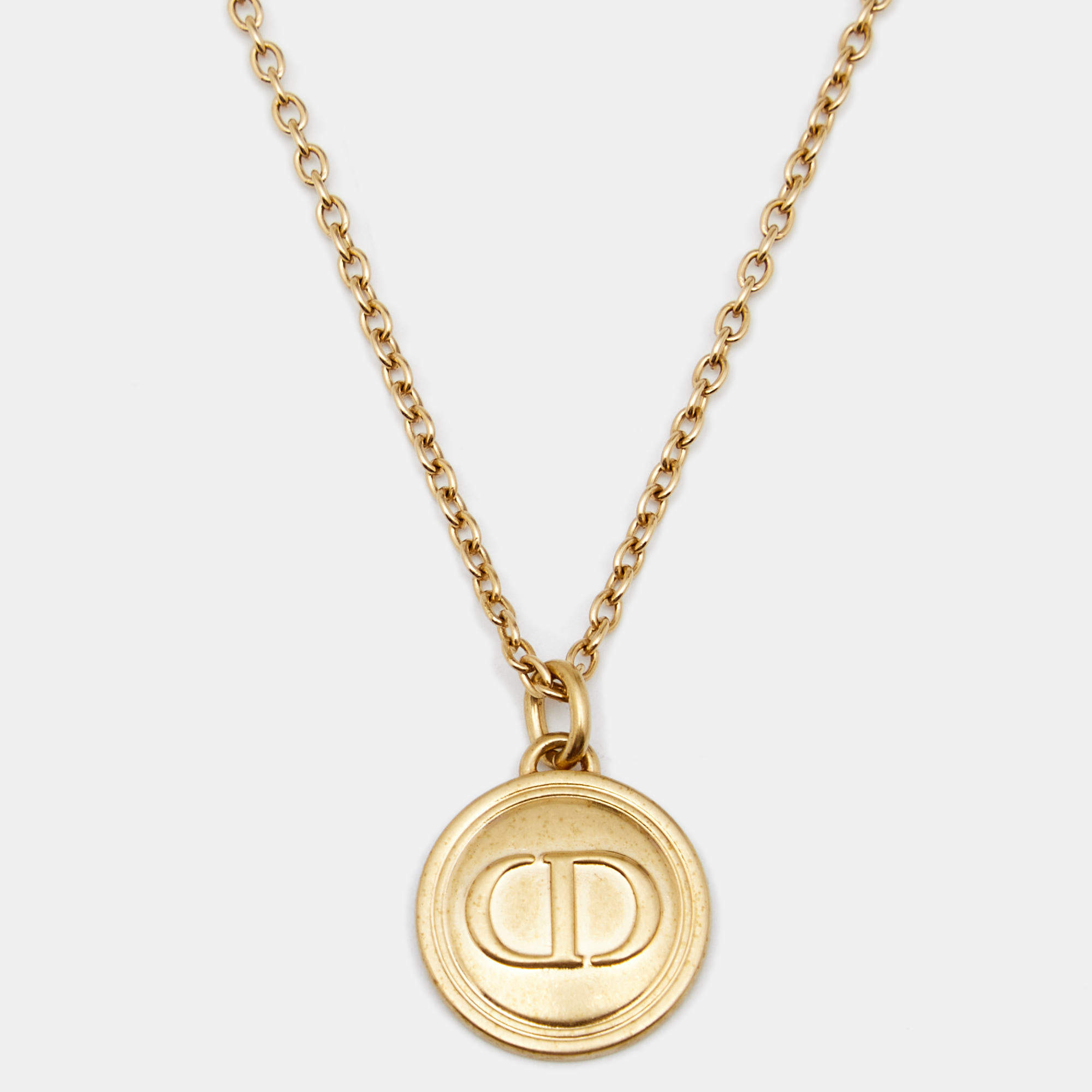 Pre Owned Dior Gold Tone Logo Embossed Round Pendant Necklace