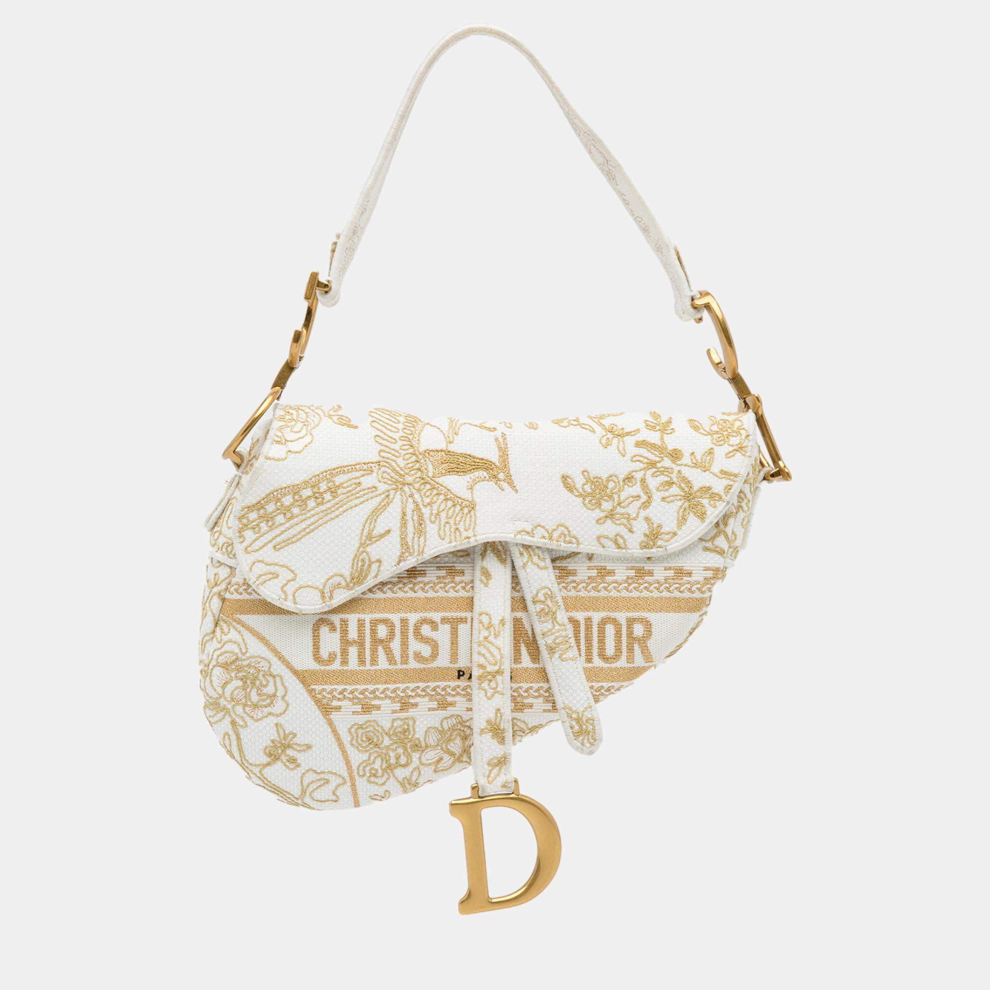 white and gold dior saddle bag