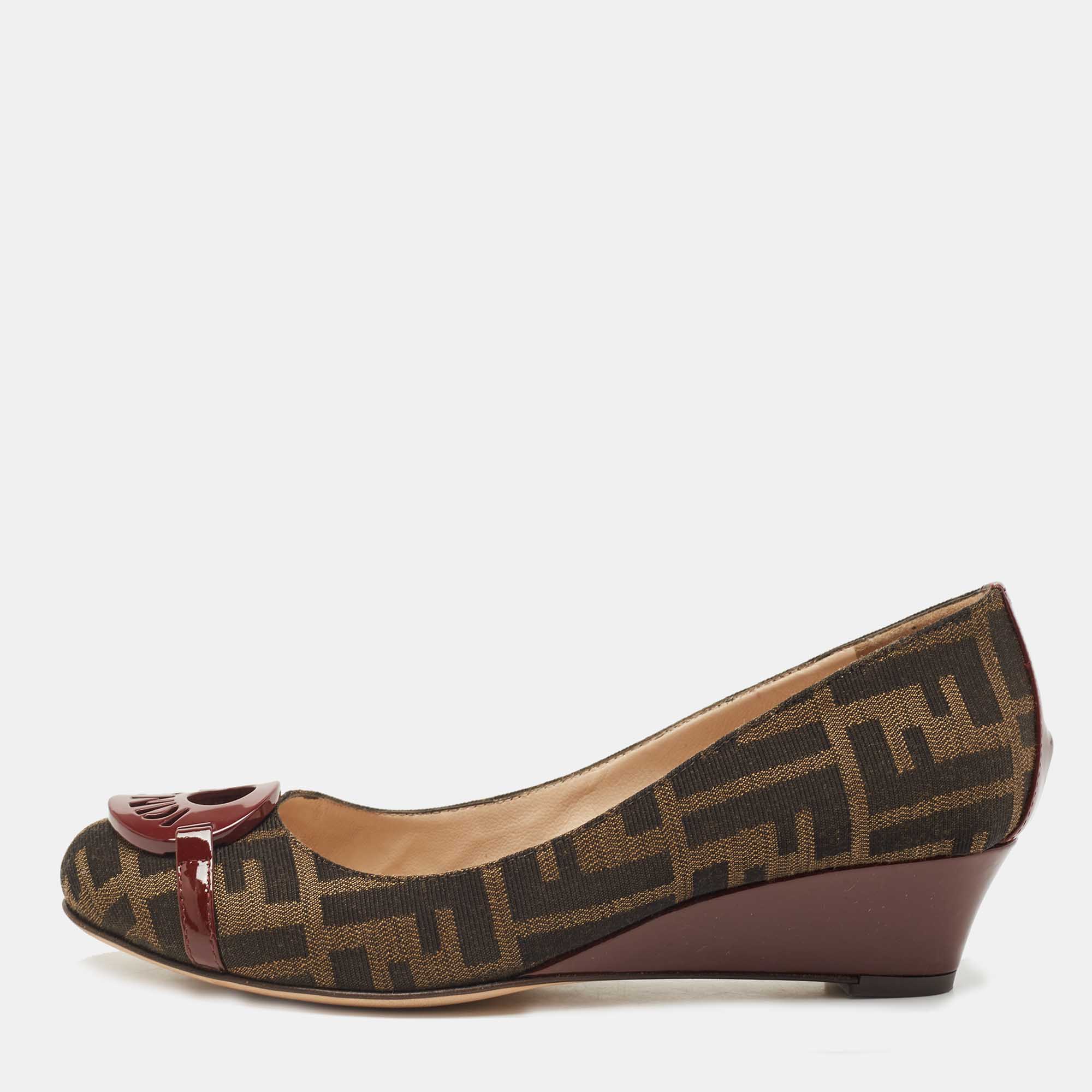 Pre Owned Fendi Burgundy/Brown Patent Leather and Tobacco Zucca Canvas Logo Plate Wedge Pumps Size 37.5
