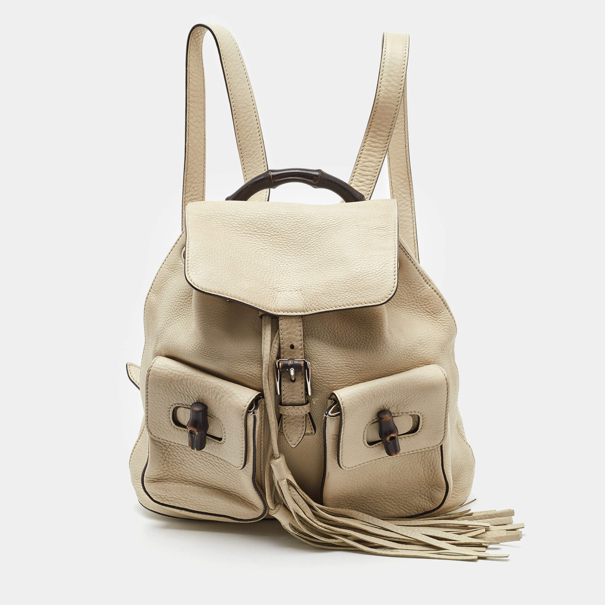 Pre Owned Gucci Off White Pebbled Leather GG Bamboo Tassel Backpack