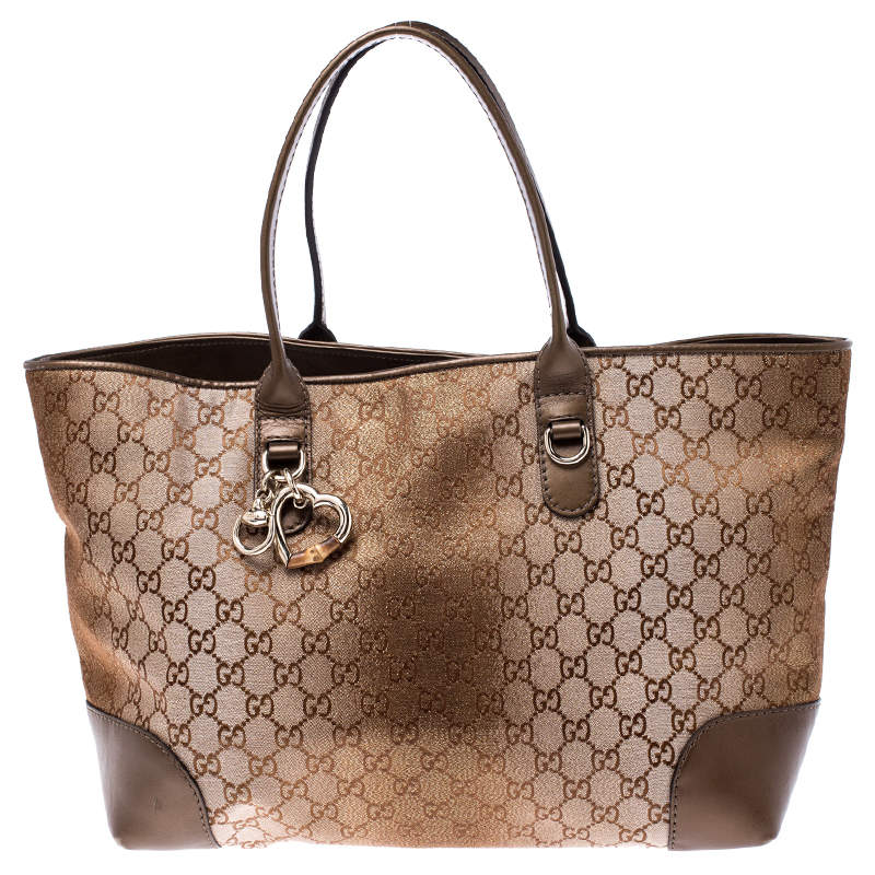 Pre Owned Gucci Beige/Bronze GG Canvas and Leather Medium Charms Embellished Heart Bit Tote