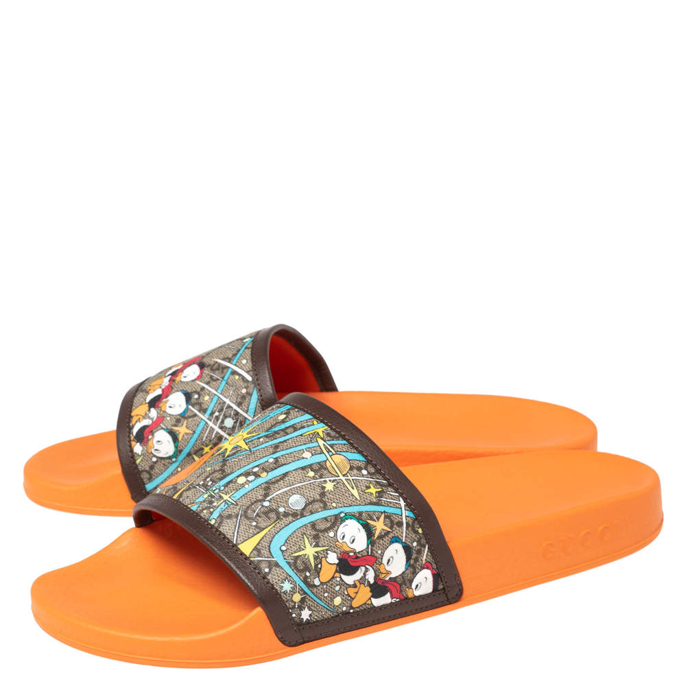 Womens gucci disney slides hot sale