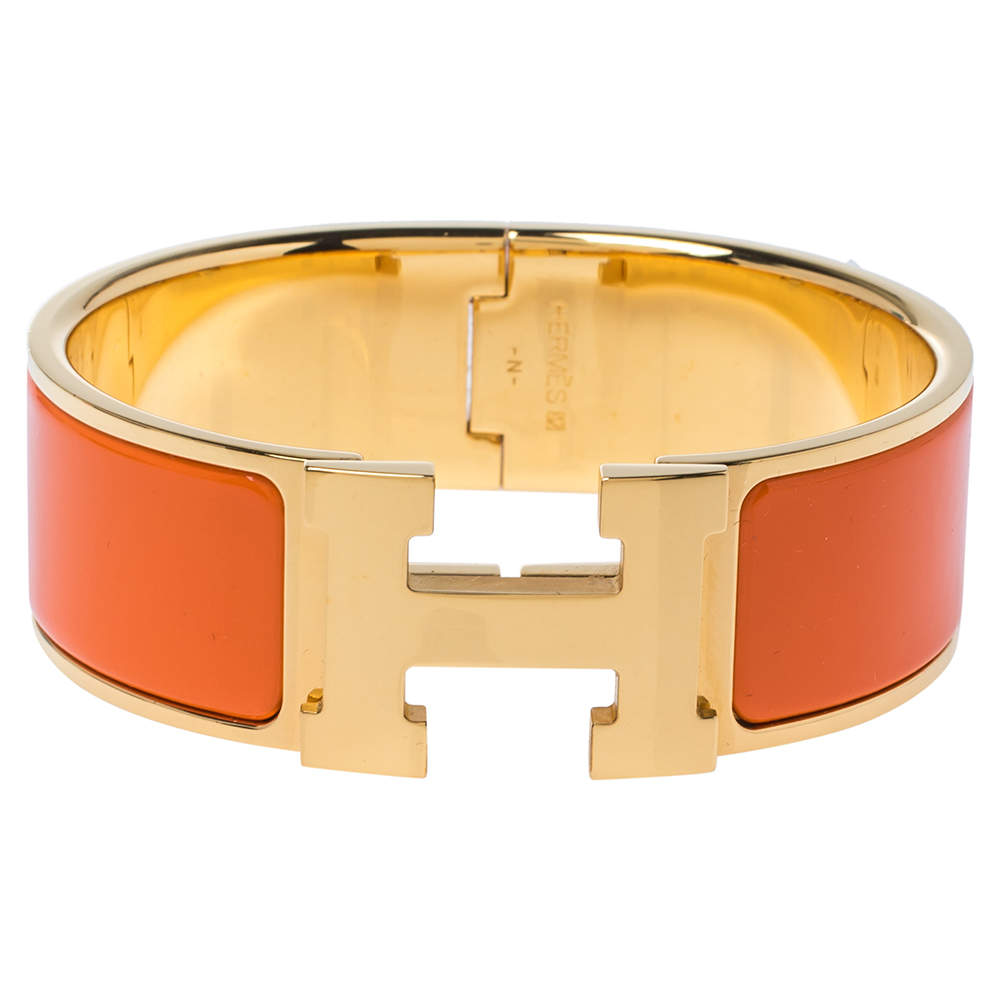 Pre Owned Hermes Clic Clac H Orange Enamel Gold Plated Wide Bracelet PM