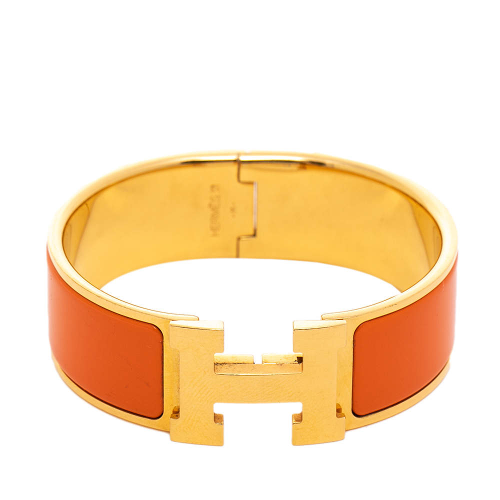 Pre Owned Hermès Clic Clac H Orange Enamel Gold Plated Wide Bracelet PM