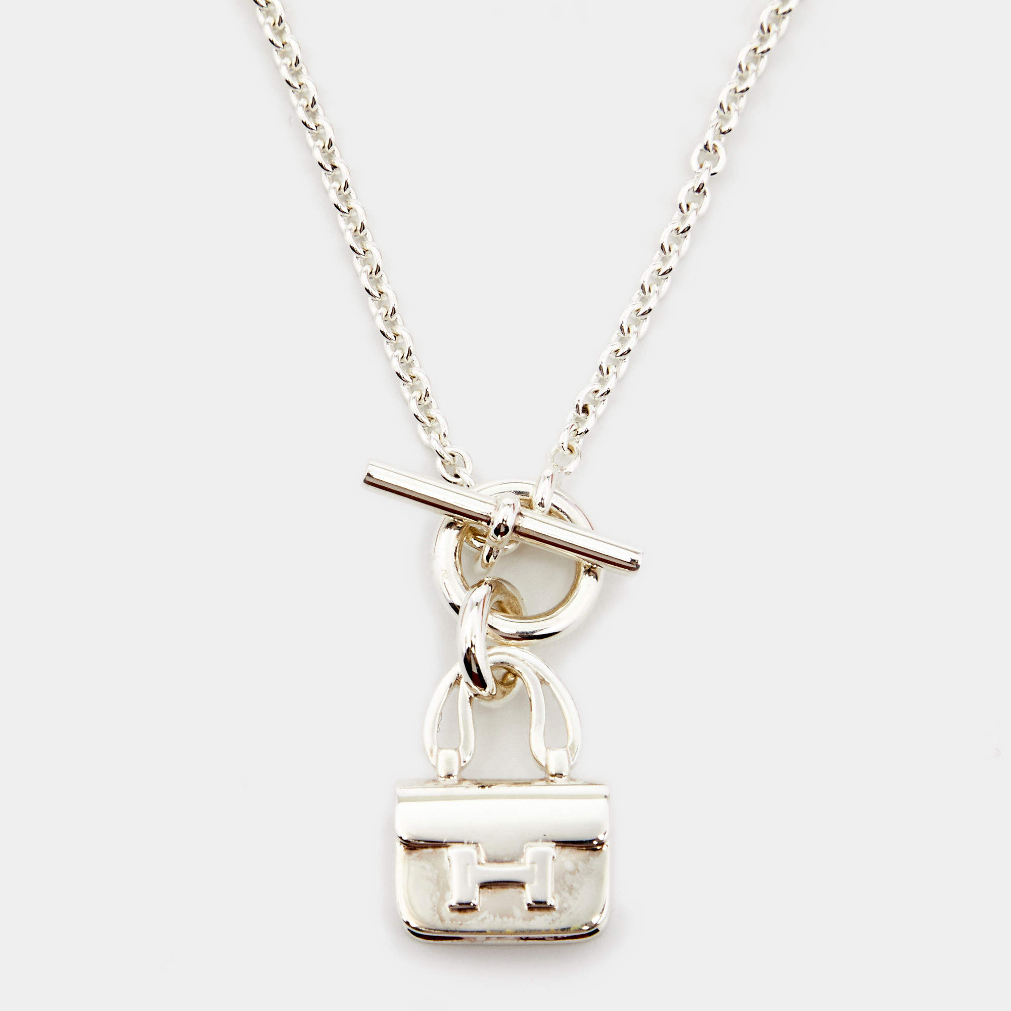 Pre Owned Hermès Sterling Silver Amulettes Constance Pendant Toggle Necklace
