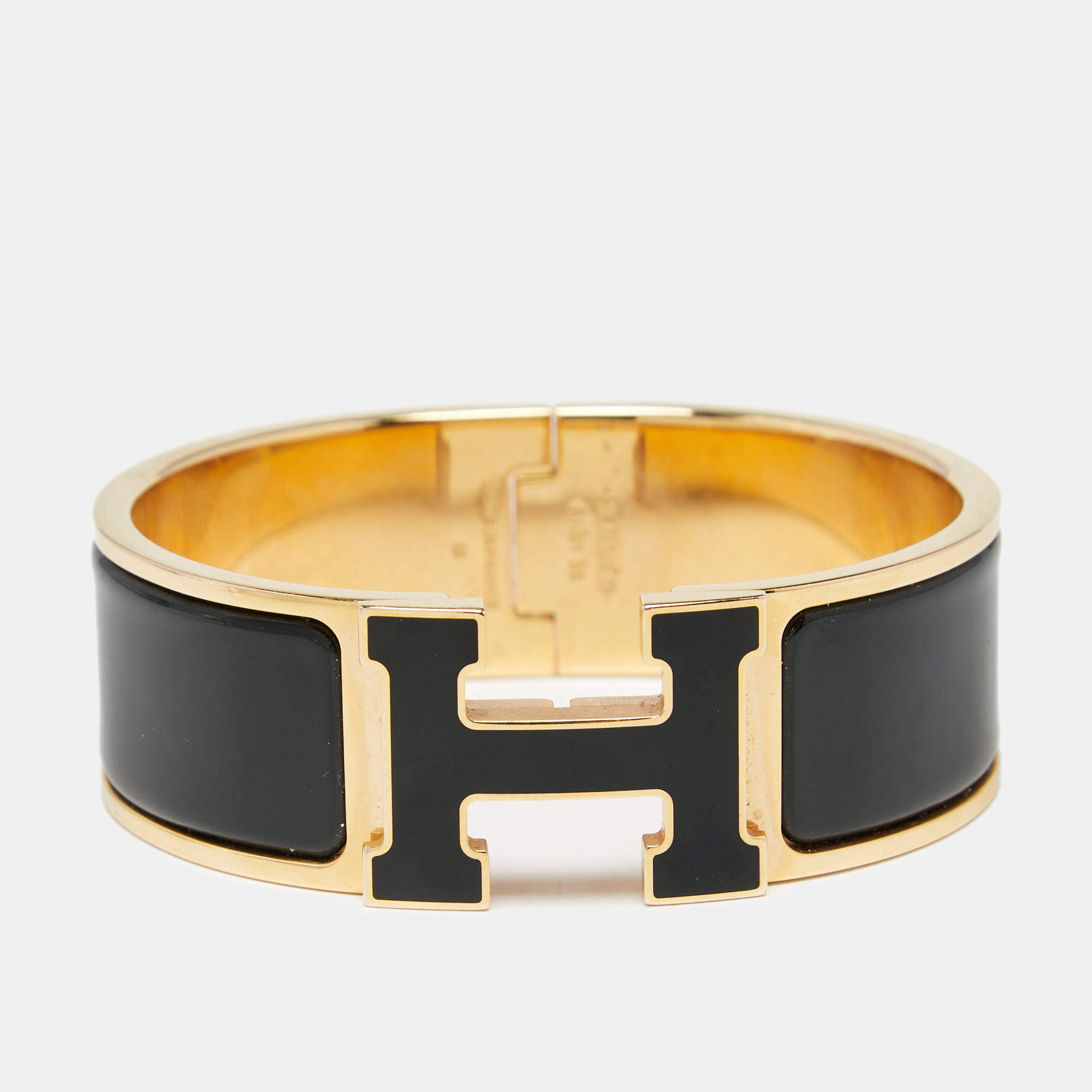 Pre Owned Hermes Clic H Black Enamel Gold Tone Metal Bracelet