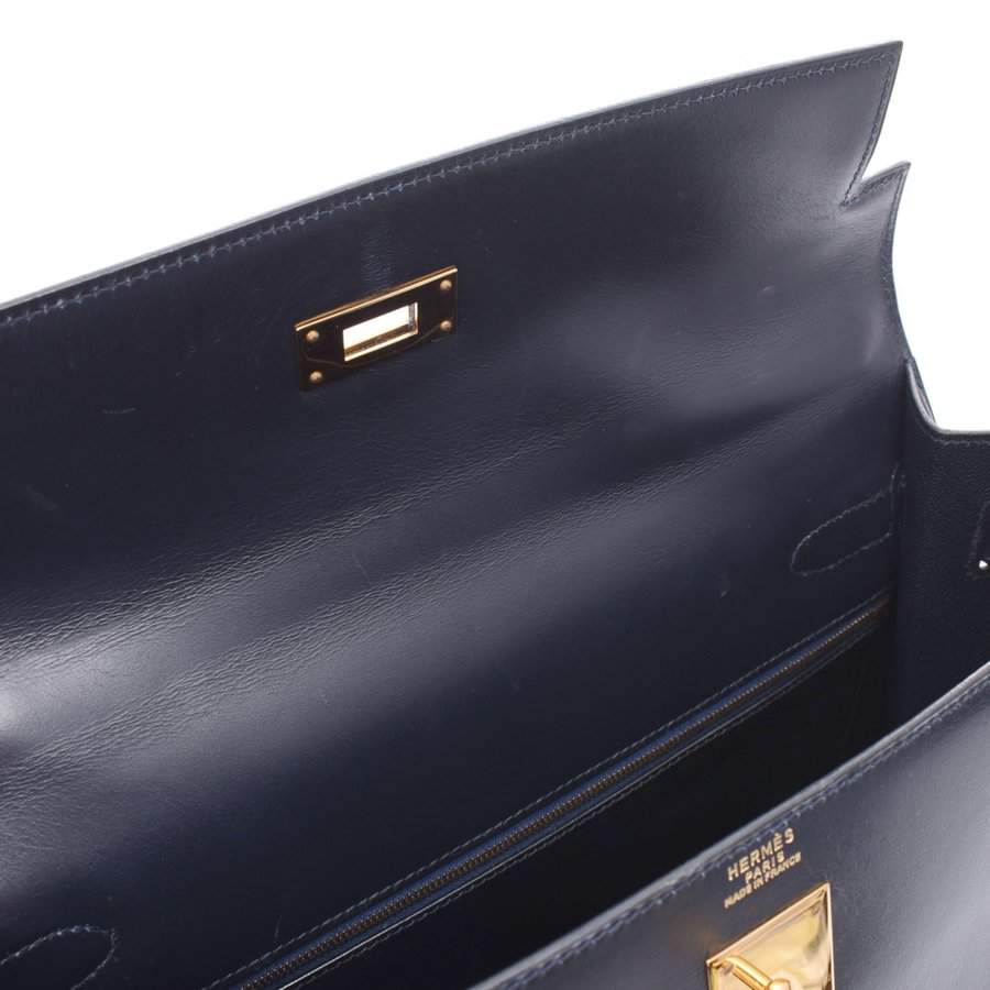 HERMES Paris - Kelly Retourné 32cm navy box bag, gold-…