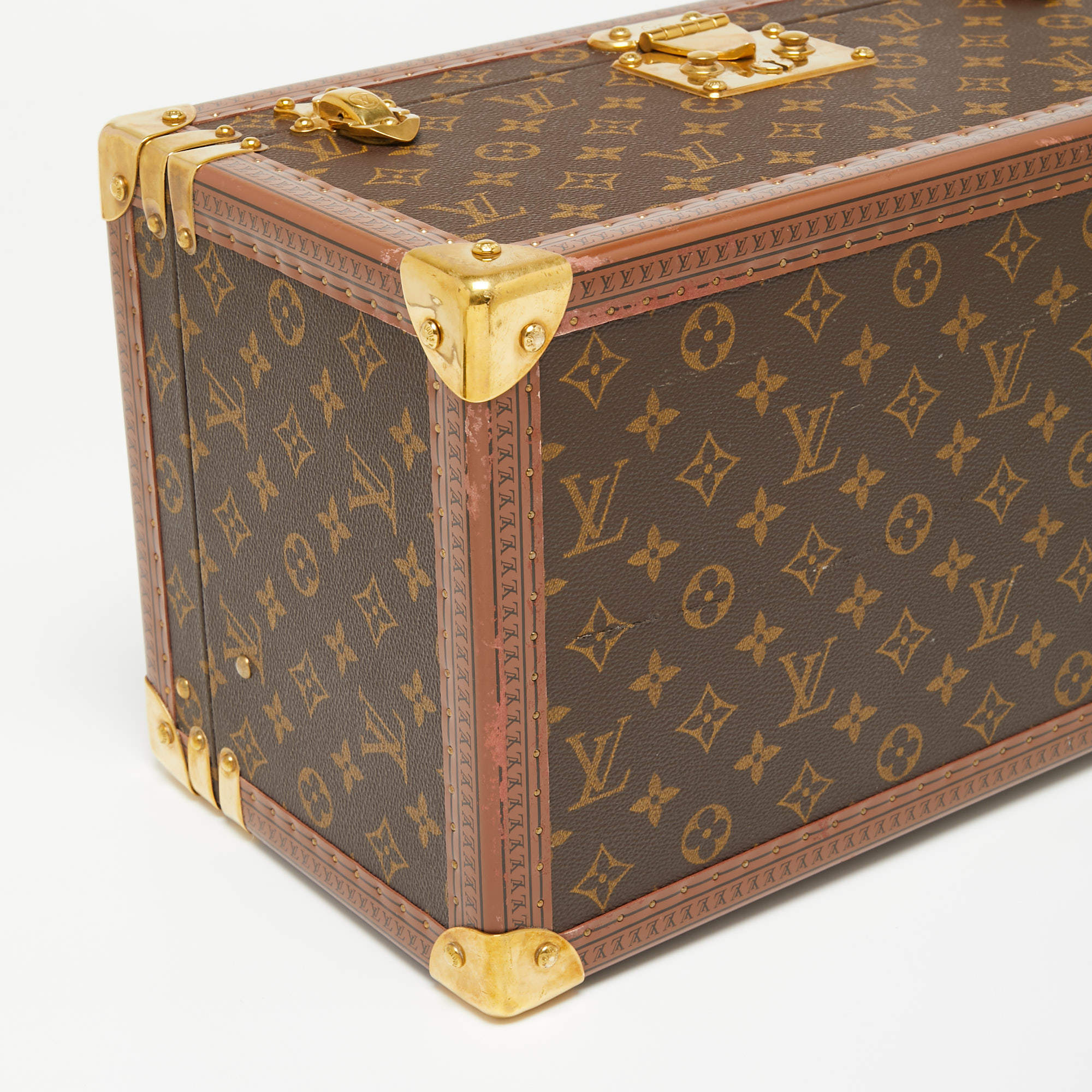 LOUIS VUITTON, beauty box, monogram canvas, interior with 3 bottle supports  and loose small makeup/jewellery bag with handle and interior mirror in  lid, brass details, handle, luggagetag, leather details, 1980s, label no.