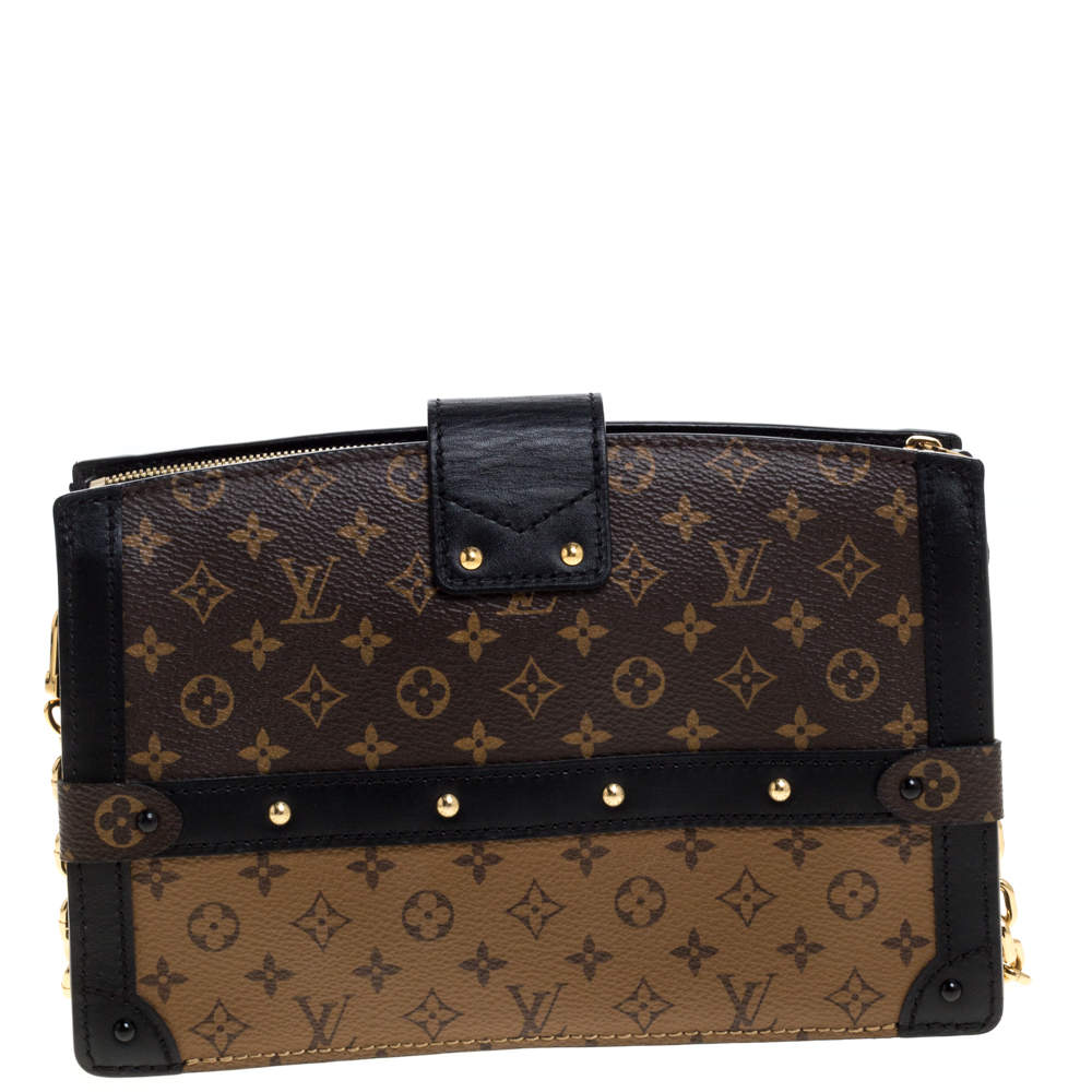 LOUIS VUITTON Monogram canvas hand clutch with leather t…