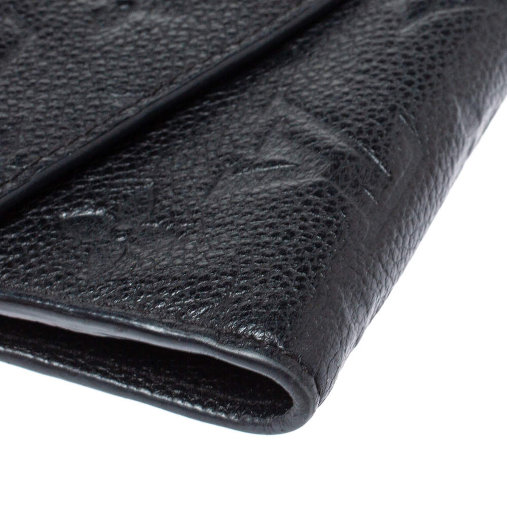 Louis Vuitton, a black Monogram Empreinte leather 'Curieuse' wallet, 2015.  - Bukowskis