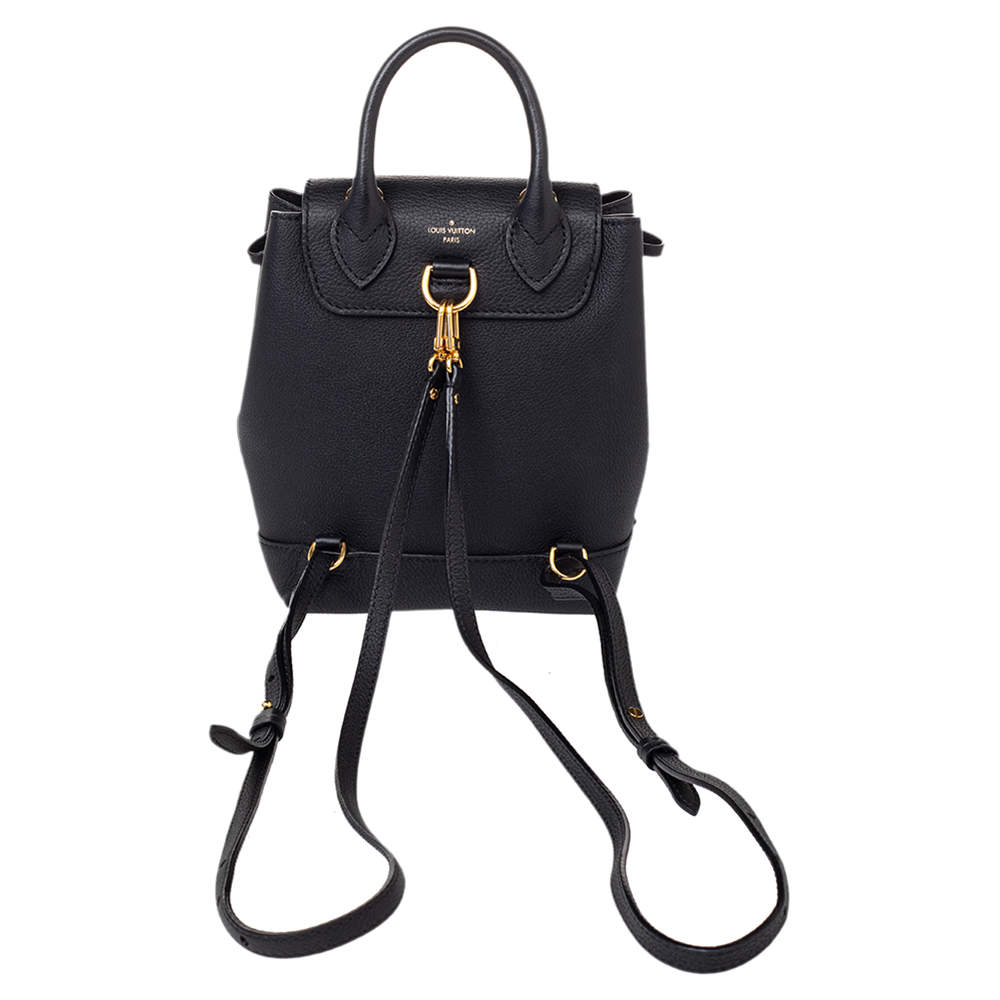 Louis Vuitton Black Mini Lock Me Backpack Bag in Grained Leather with –  Sellier