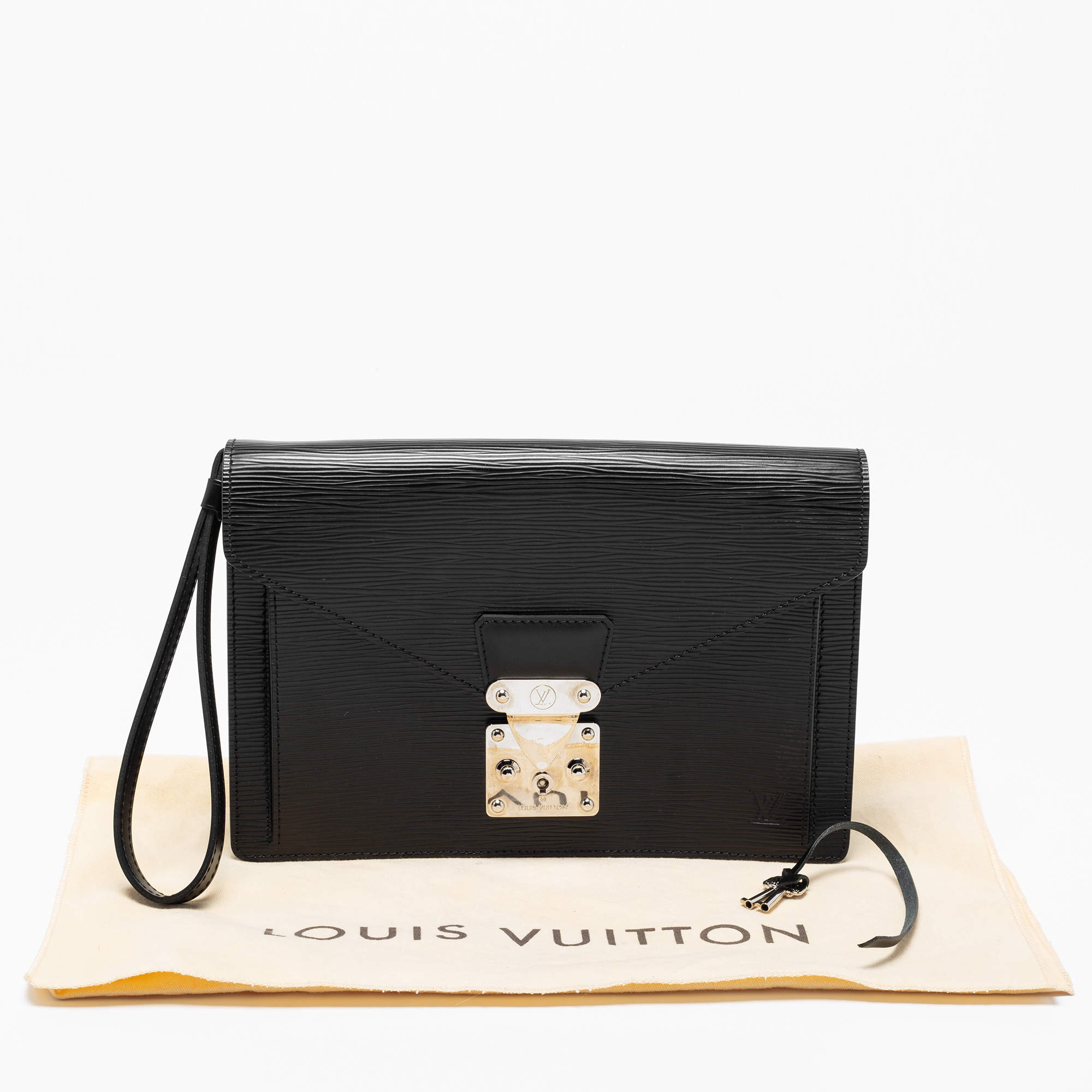 Louis Vuitton, A black Epi Leather 'Sellier Dragonne' Clutch. - Bukowskis
