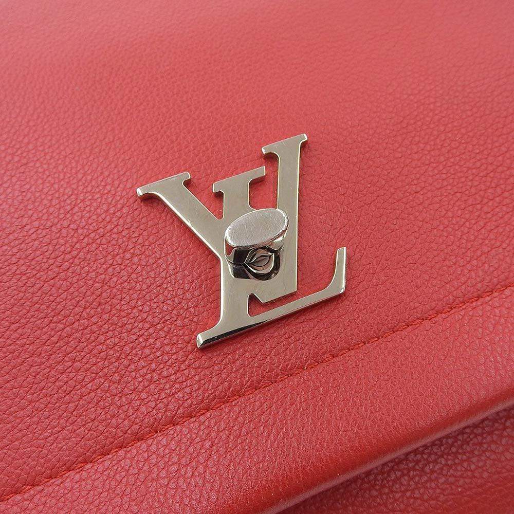 Lot - Louis Vuitton Lockme II handbag, red leather, silver hardware, flap  top with LV clasp, opens to reveal three chambers and two interi